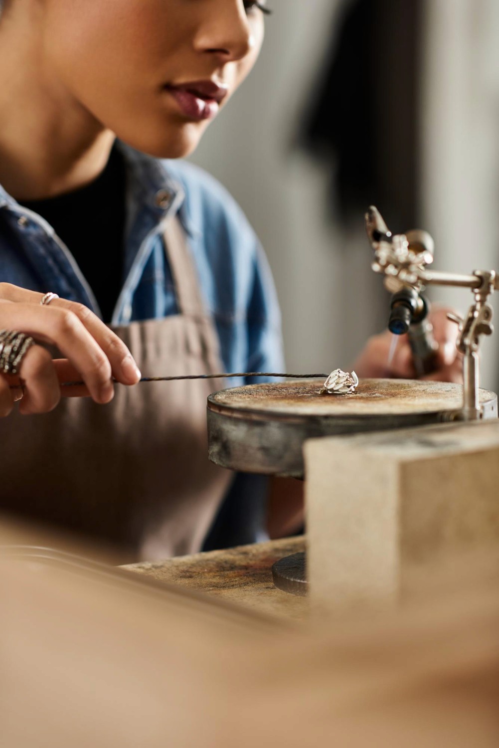 Man gesturing while speaking to colleagues in a sunlit office.
