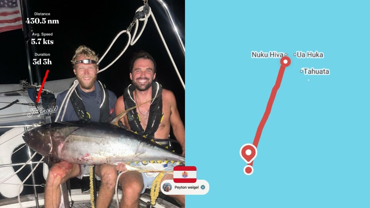 Two people on a sailboat catching a fish in French Polynesia