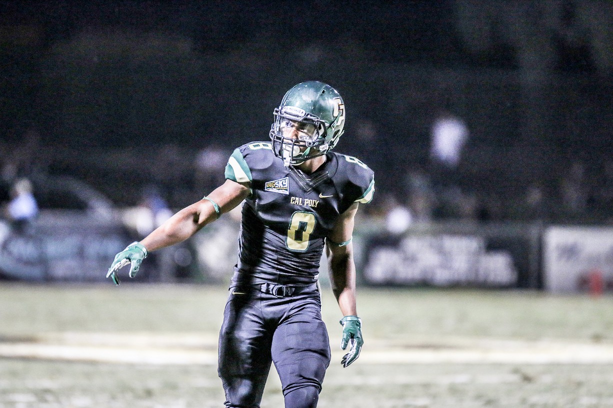 Dr. Jordan Hines playing football at Cal Poly
