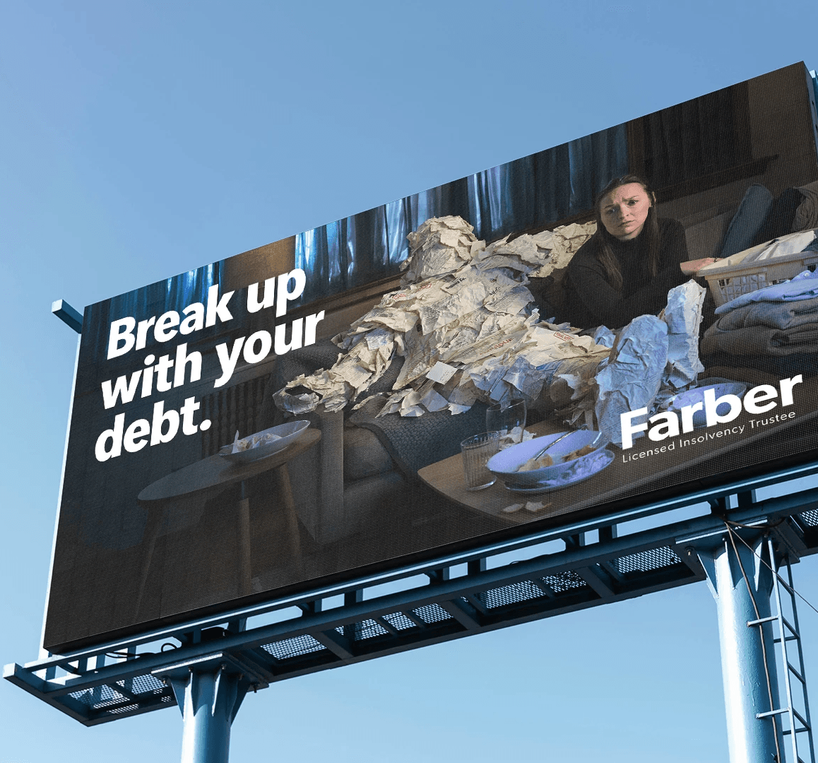 A child in a swimsuit playfully jumps with a water spray in a backyard, surrounded by toys and greenery.