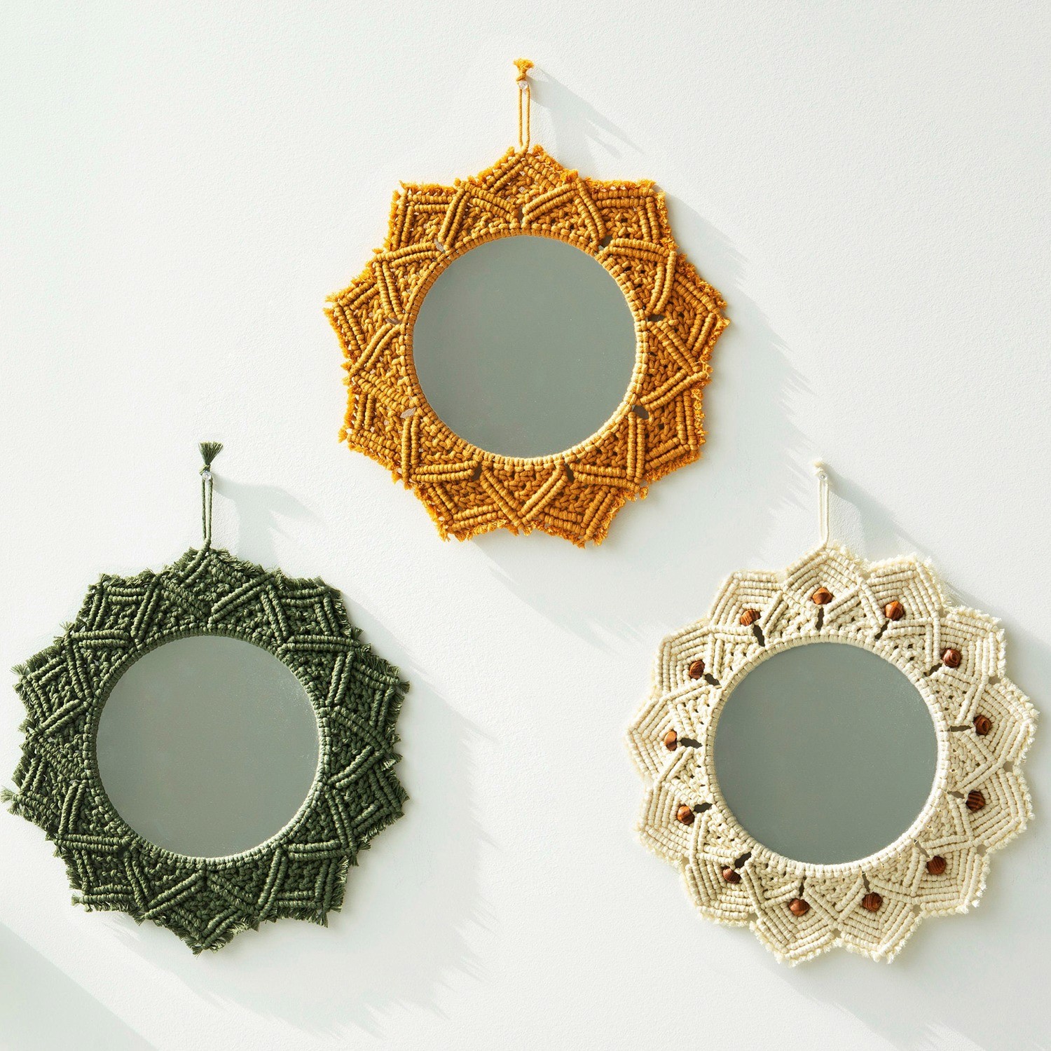 Mustard macramé sunburst wall mirror