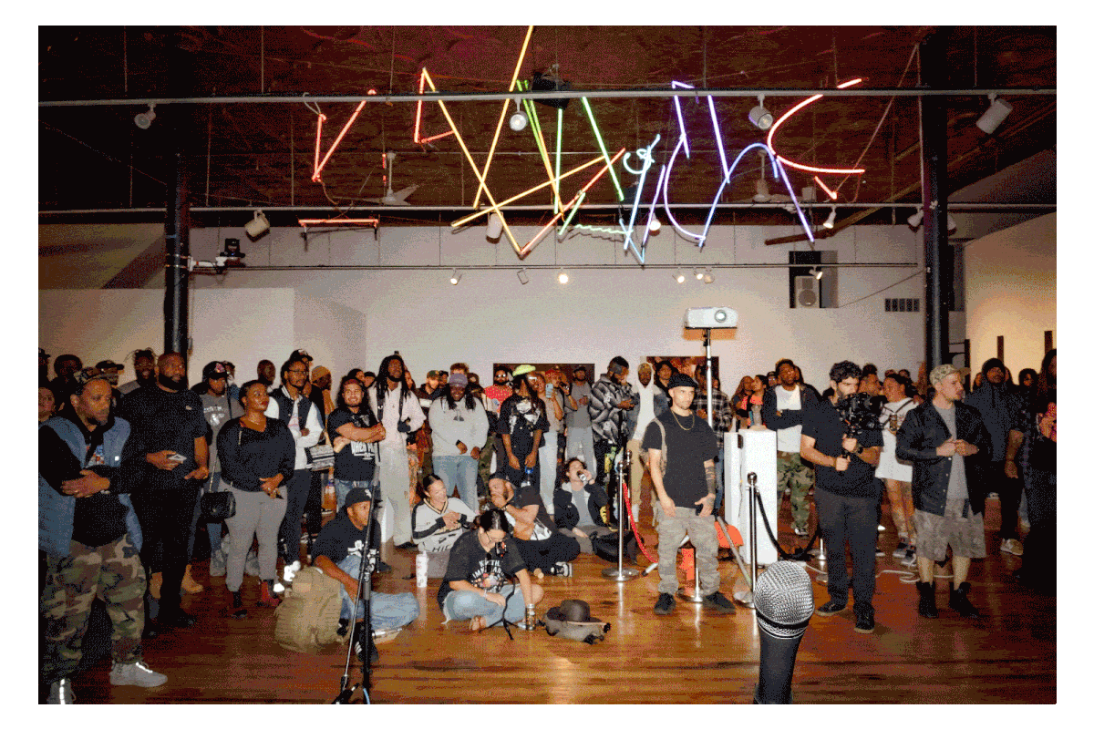 Series of images showing rappers performing at Co-Prosperity sphere and little girls chalking a sidwalk and playing jumprope at a community event.
