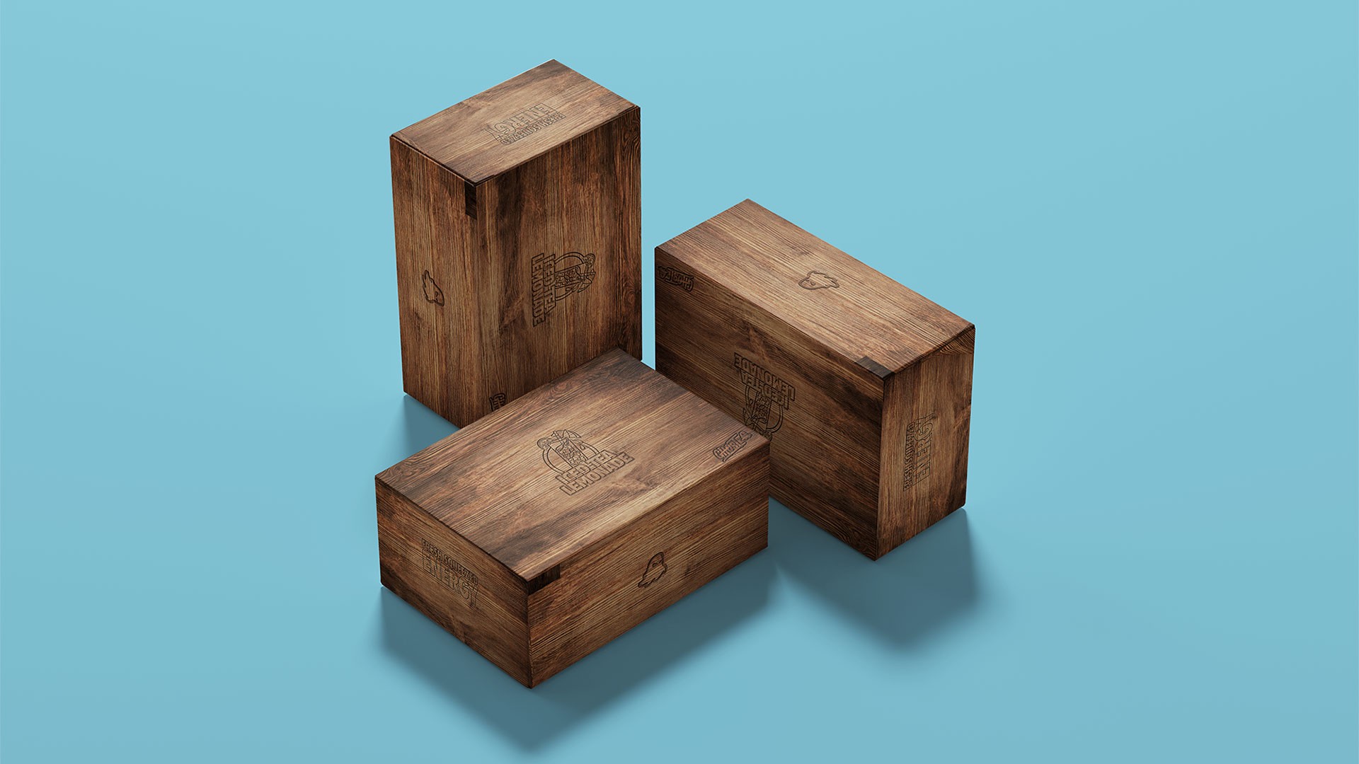 Wooden packaging concept mockups for a Ghost Energy Iced Tea Lemonade campaign featuring engraved branding and premium promotional box design.