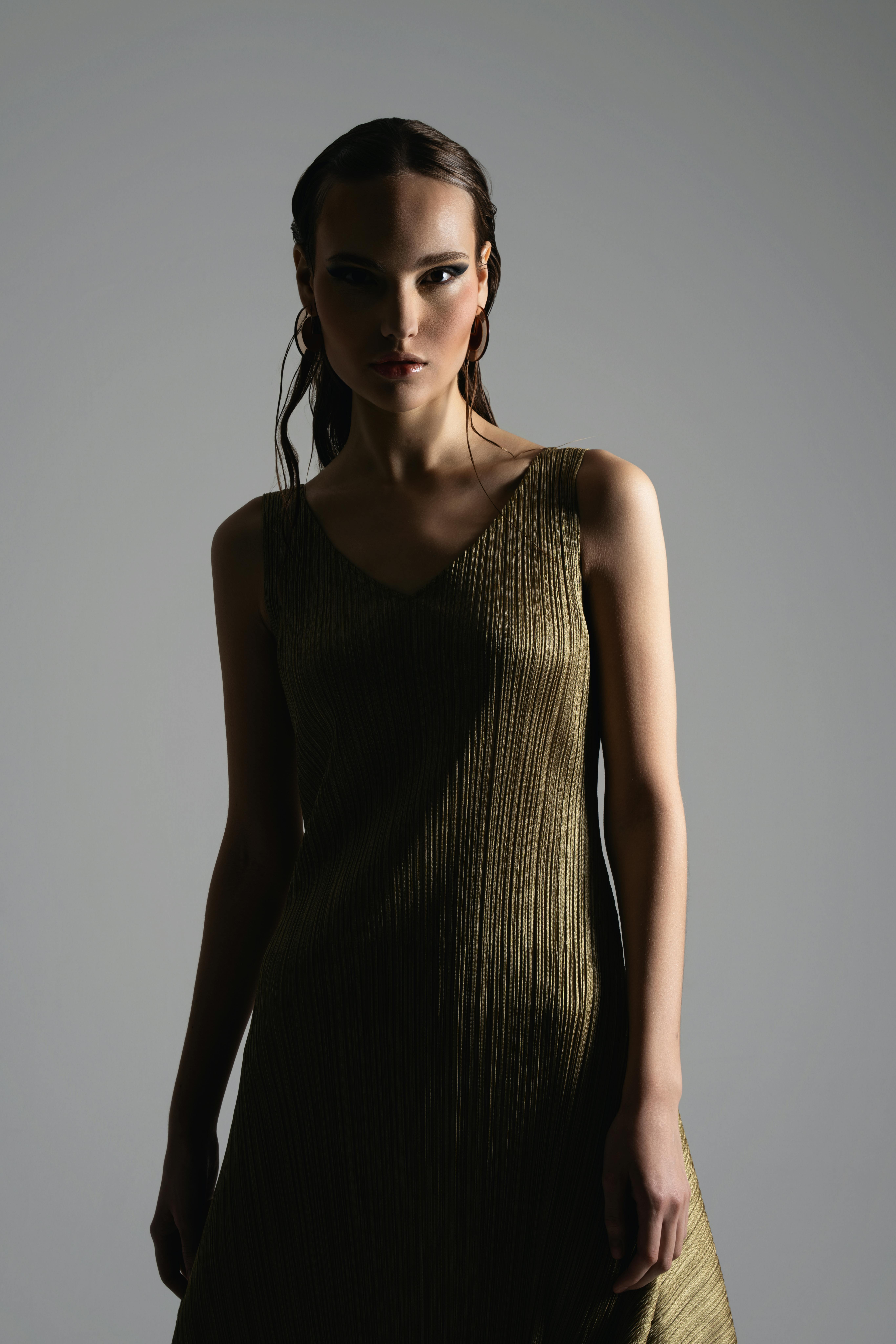 Woman in olive color dress