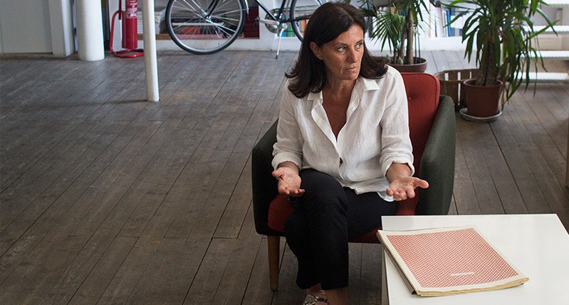 a woman giving a talk about the book