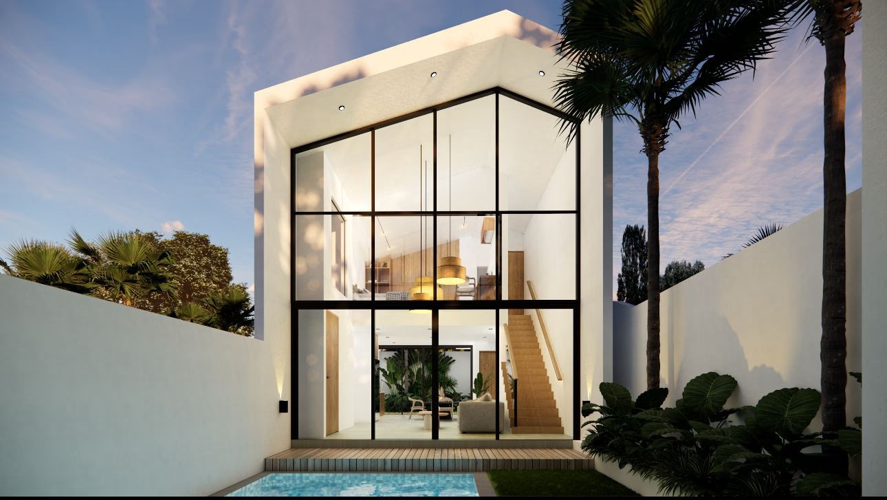 Modern white house with a large glass facade at Olympus Aurea reflecting the sky, featuring a pool in the foreground, surrounded by palm trees and greenery.
