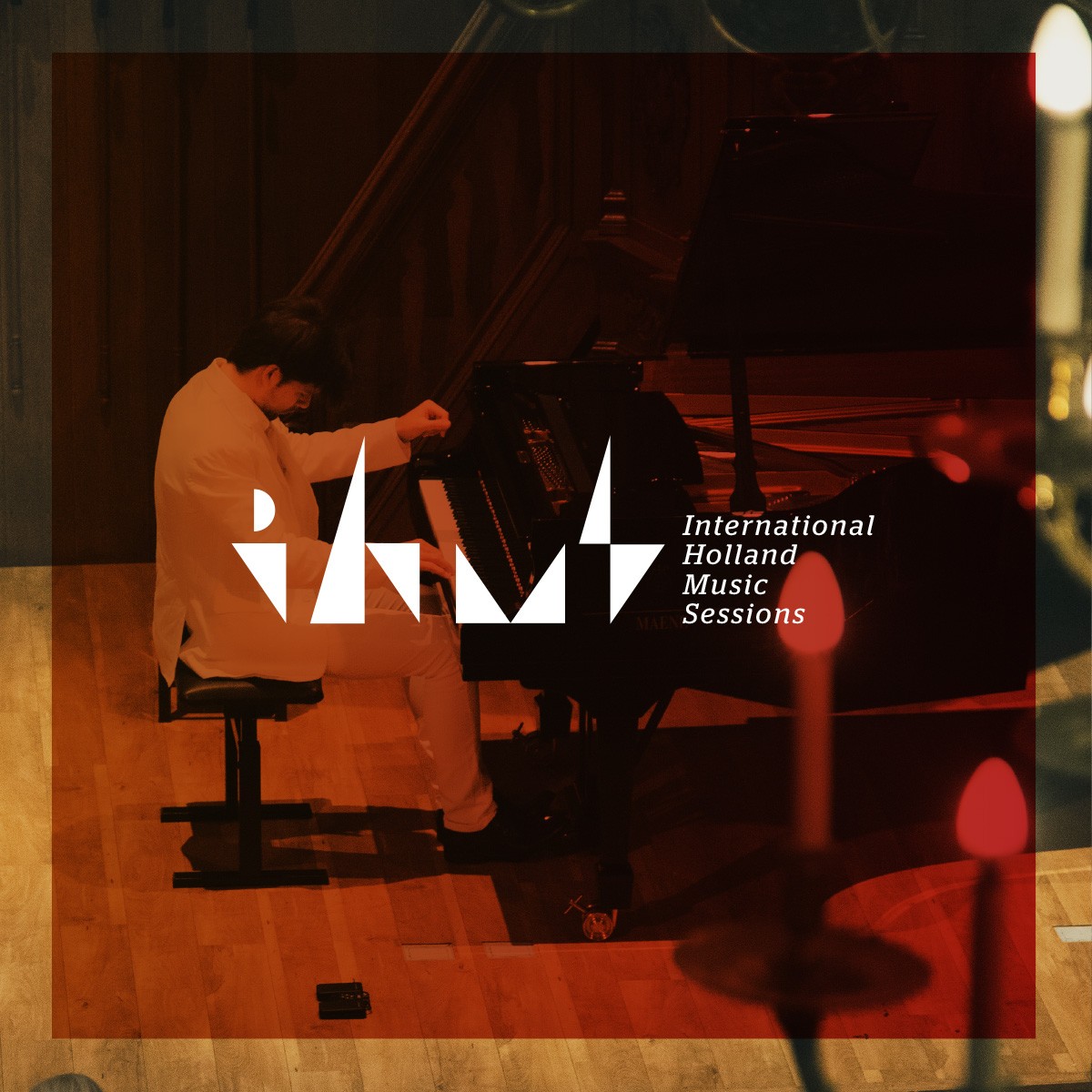 White logo for IHMS on red background