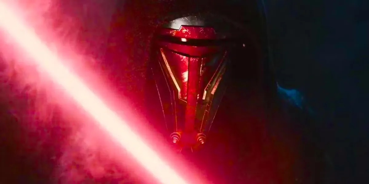 A close up look at Darth Revan wearing his signature mask and wielding a red ligthsaber against a dark background