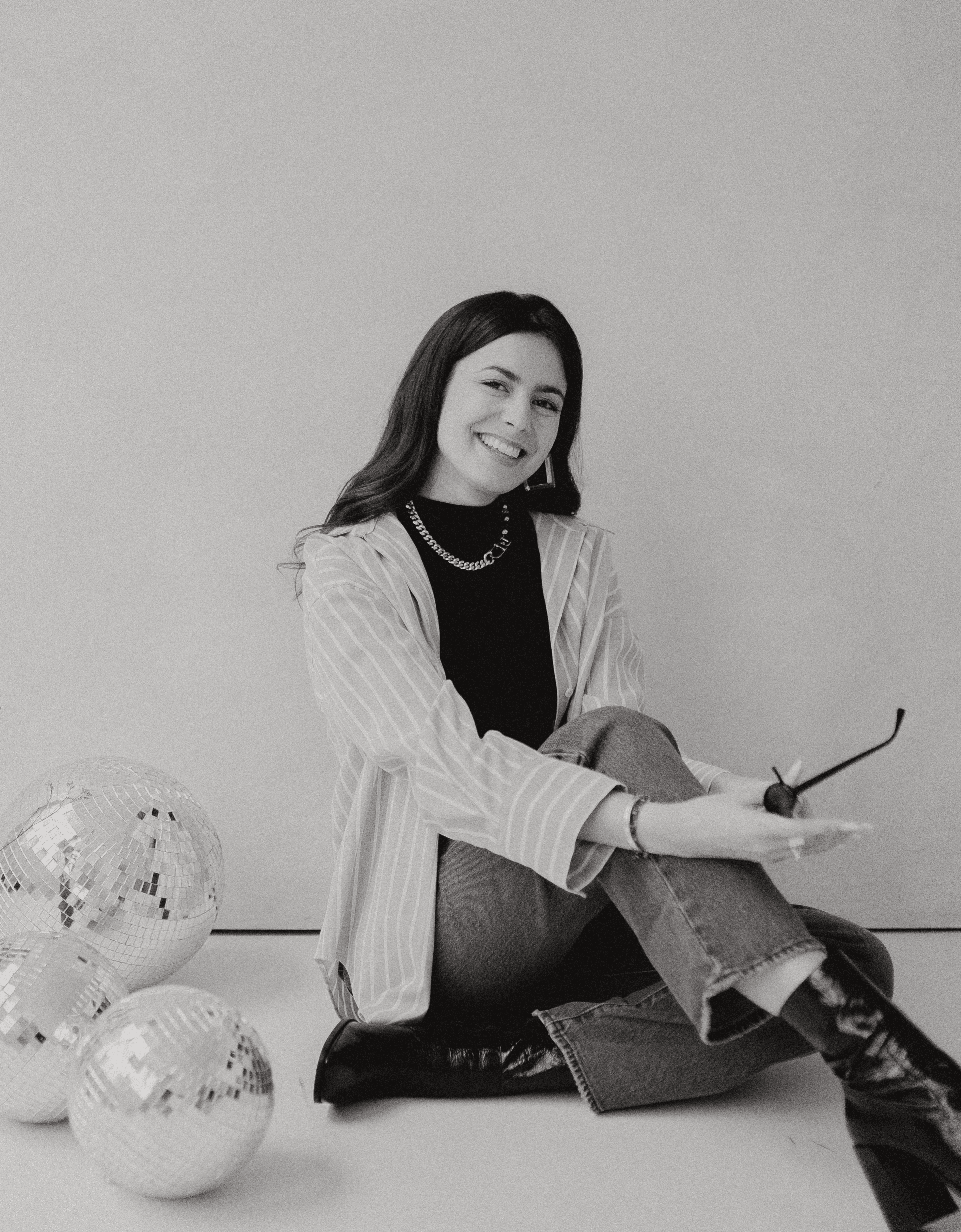 a woman holding a piece of luggage