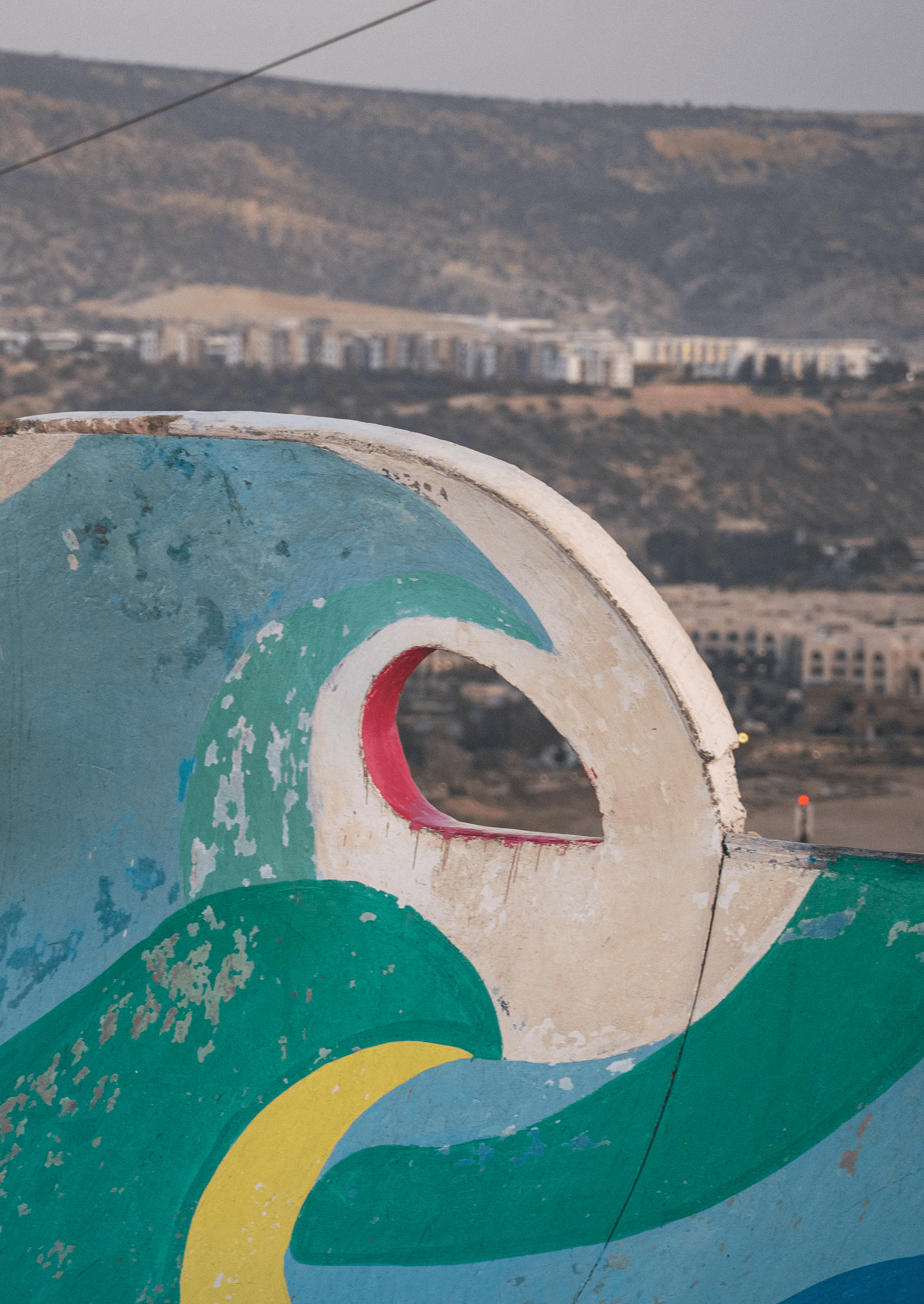 Artist painting the Atlantic coastline near Taghazout