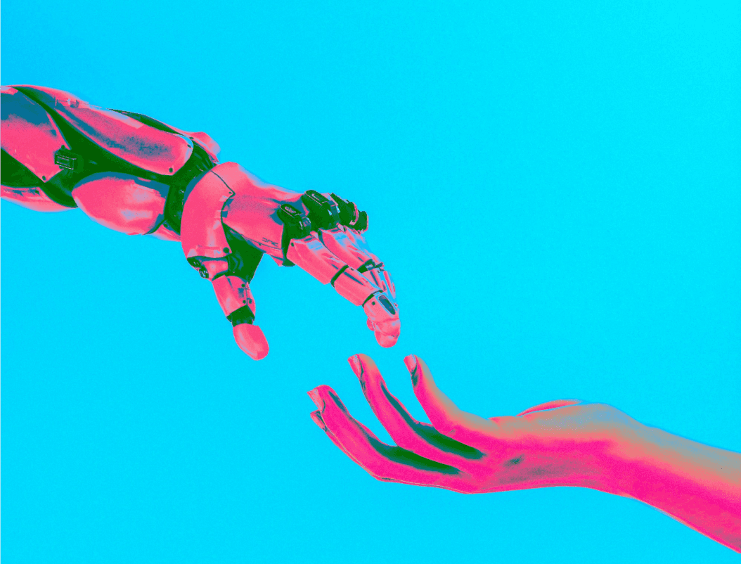 Human hand and robot (AI) hand almost touching