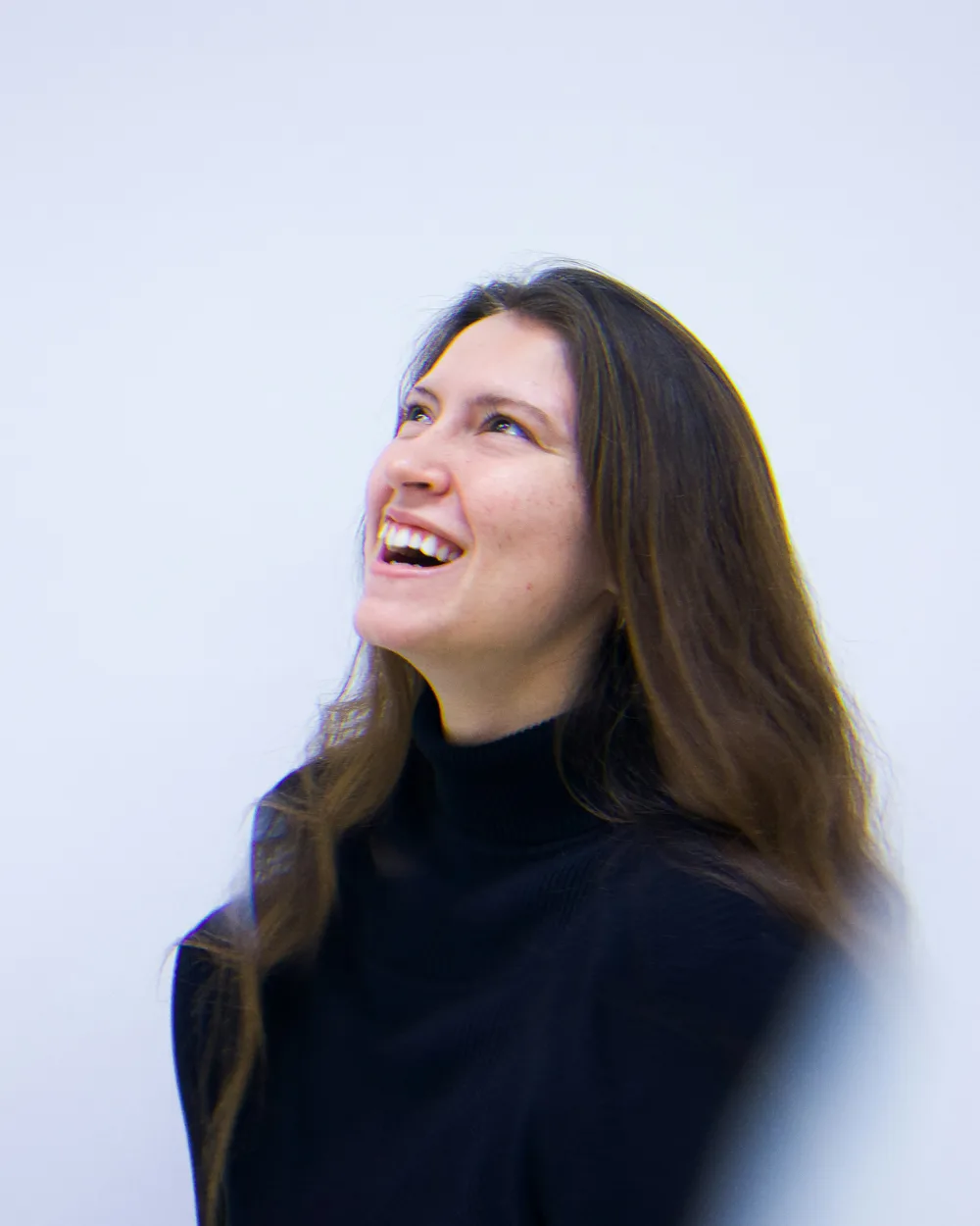 Tobi Mallory laughing, looking up