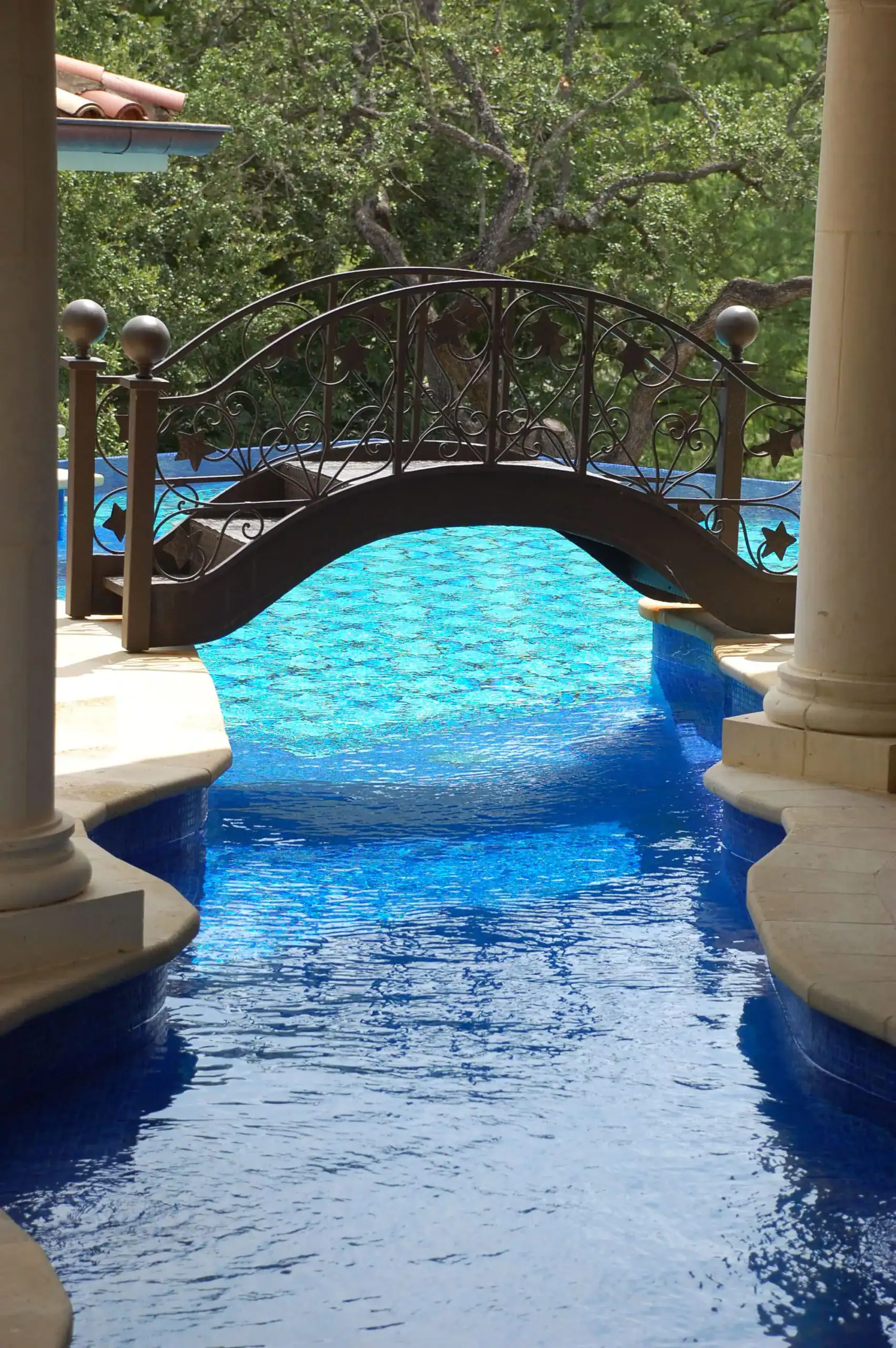 Mosaiclegs Art Studio mosaic glass pool featuring geometric design over Lake Austin, showcasing vibr.
