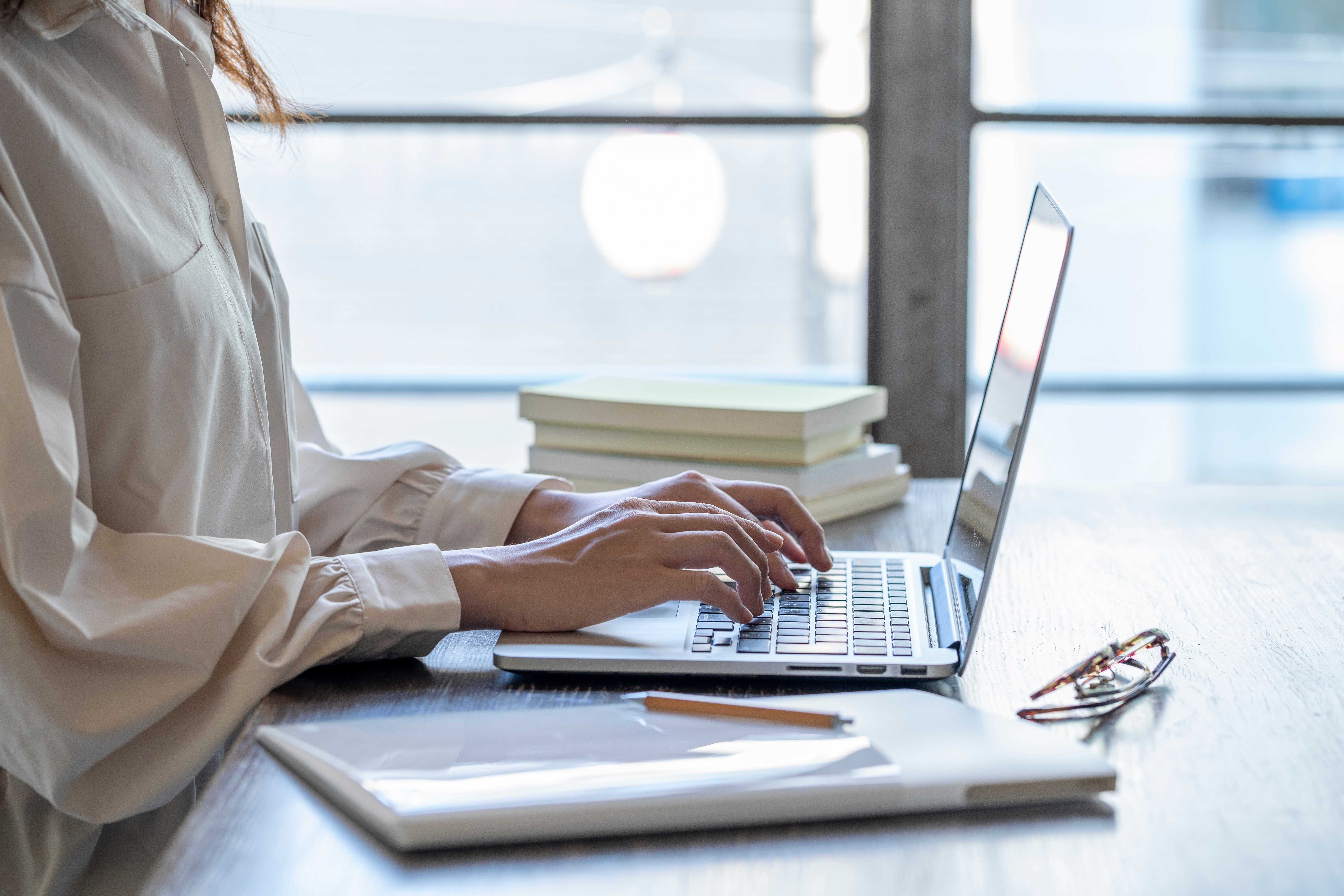 people sitting on chair in front of laptop computers
