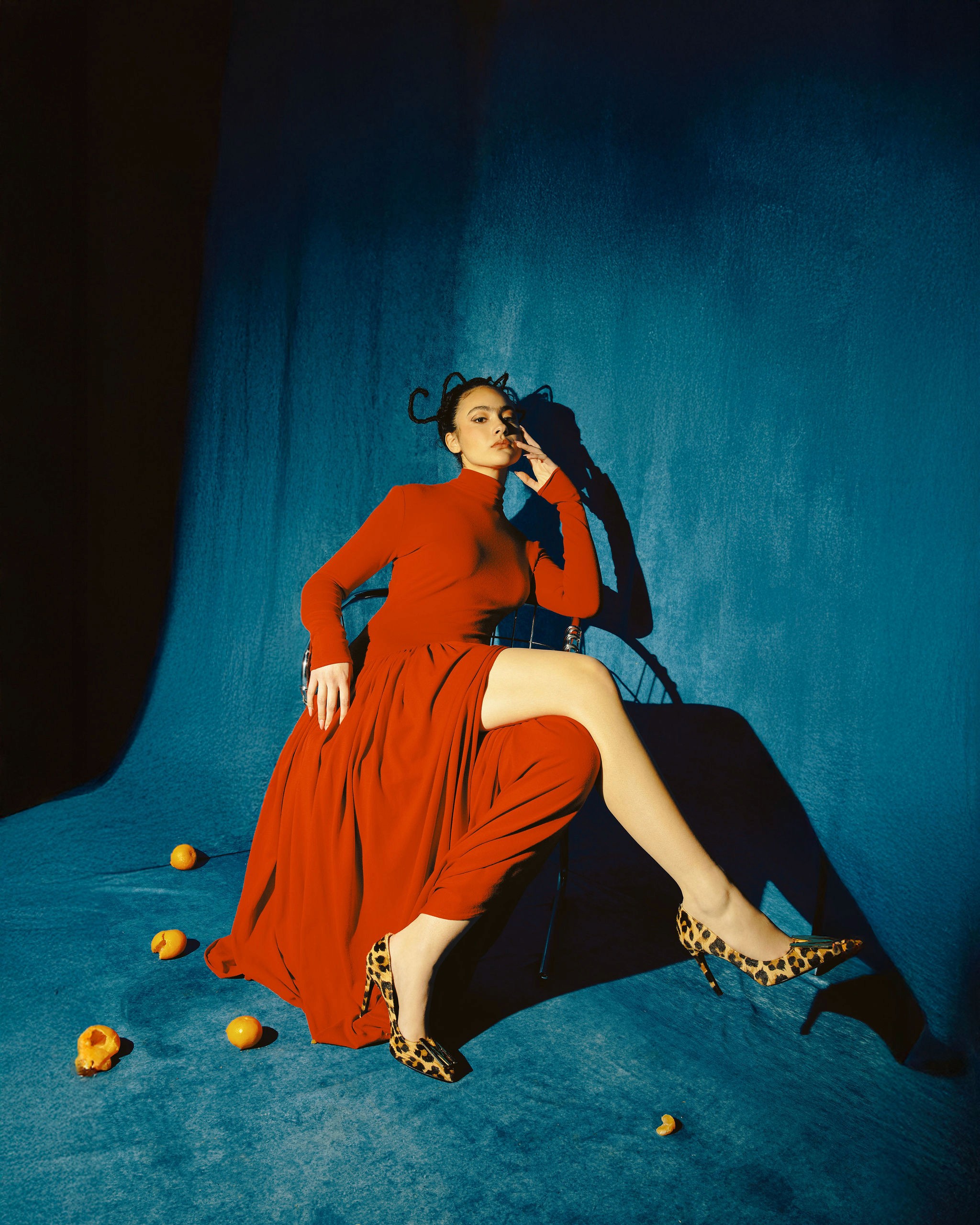 Woman with red hair covering mouth with hair