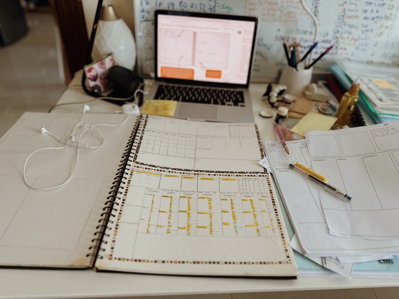 Birds flying over the ocean at sunset