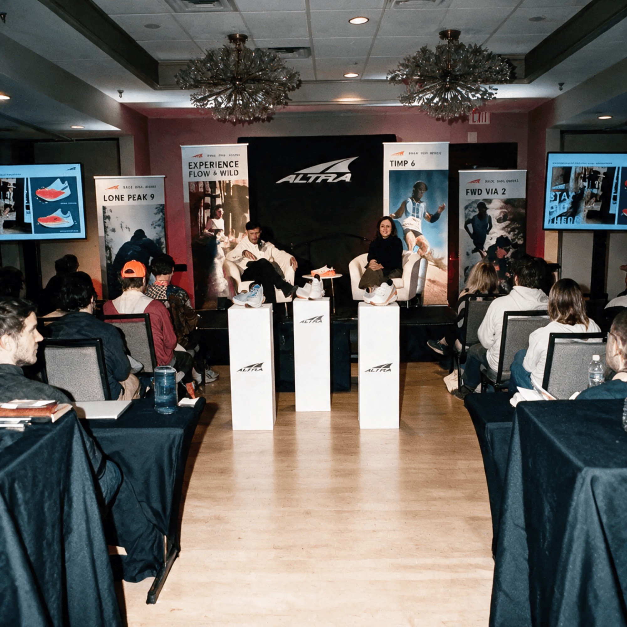 Reebok's Brand Summit stage with red lighting and branded signage