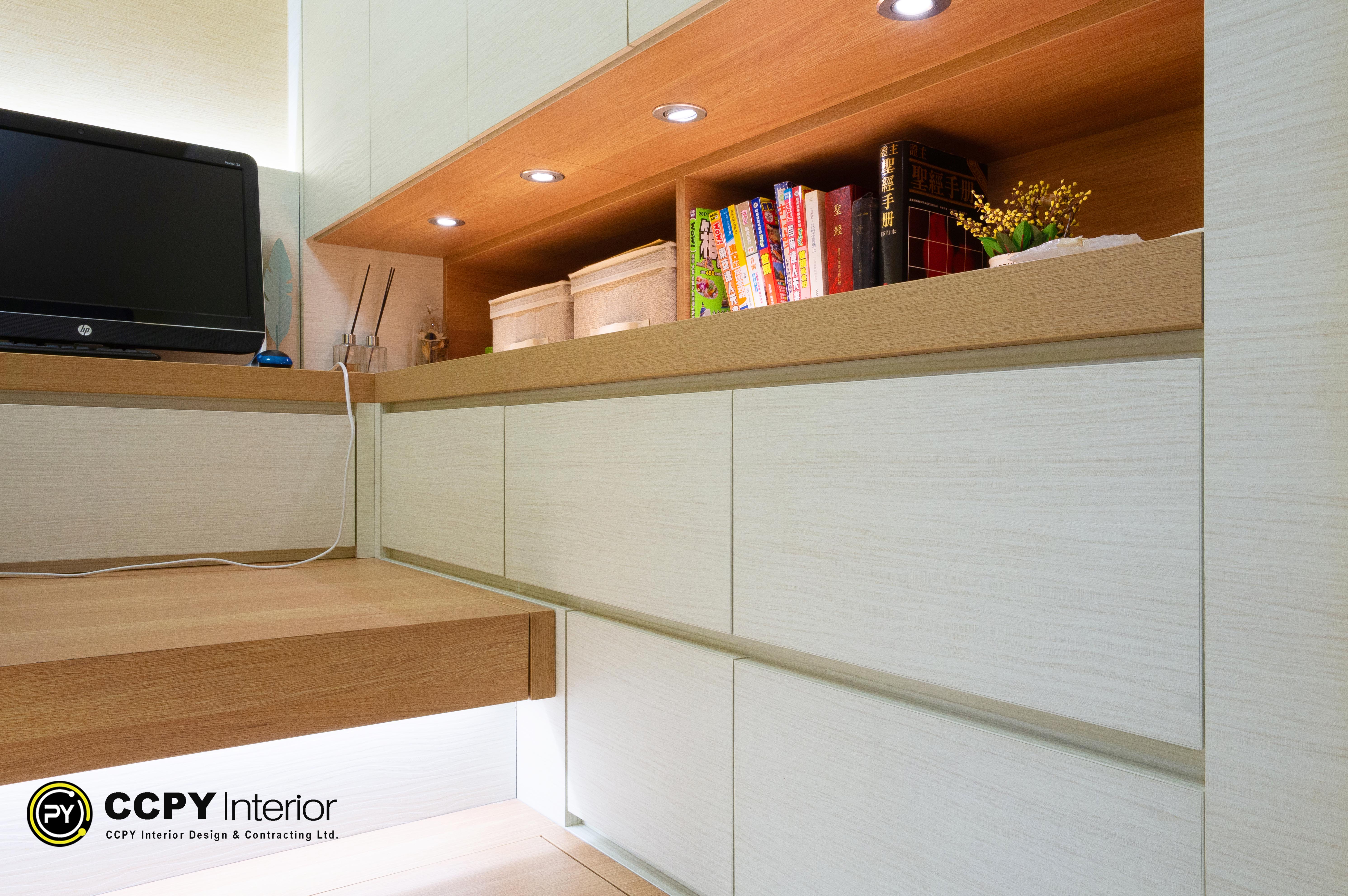 This is a custom-designed white and oak wood tatami bedroom set by CCPY Interior.Storage & Function: The design features integrated drawers for clothing and a raised platform (tatami) that increases floor-level storage capacity.Lighting: Recessed warm spotlights are built into the overhead shelving to soften the wood tones and create a cozy atmosphere.Style: The furniture adopts a modern, minimalist style focused on maximizing utility in compact spaces, featuring sleek lines and a monochromatic palette.