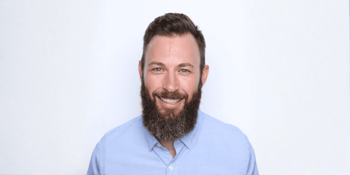 "Justin Currie, CEO of Masters of Home Care, smiling confidently, representing leadership, mentorship, and scalable home care business success."