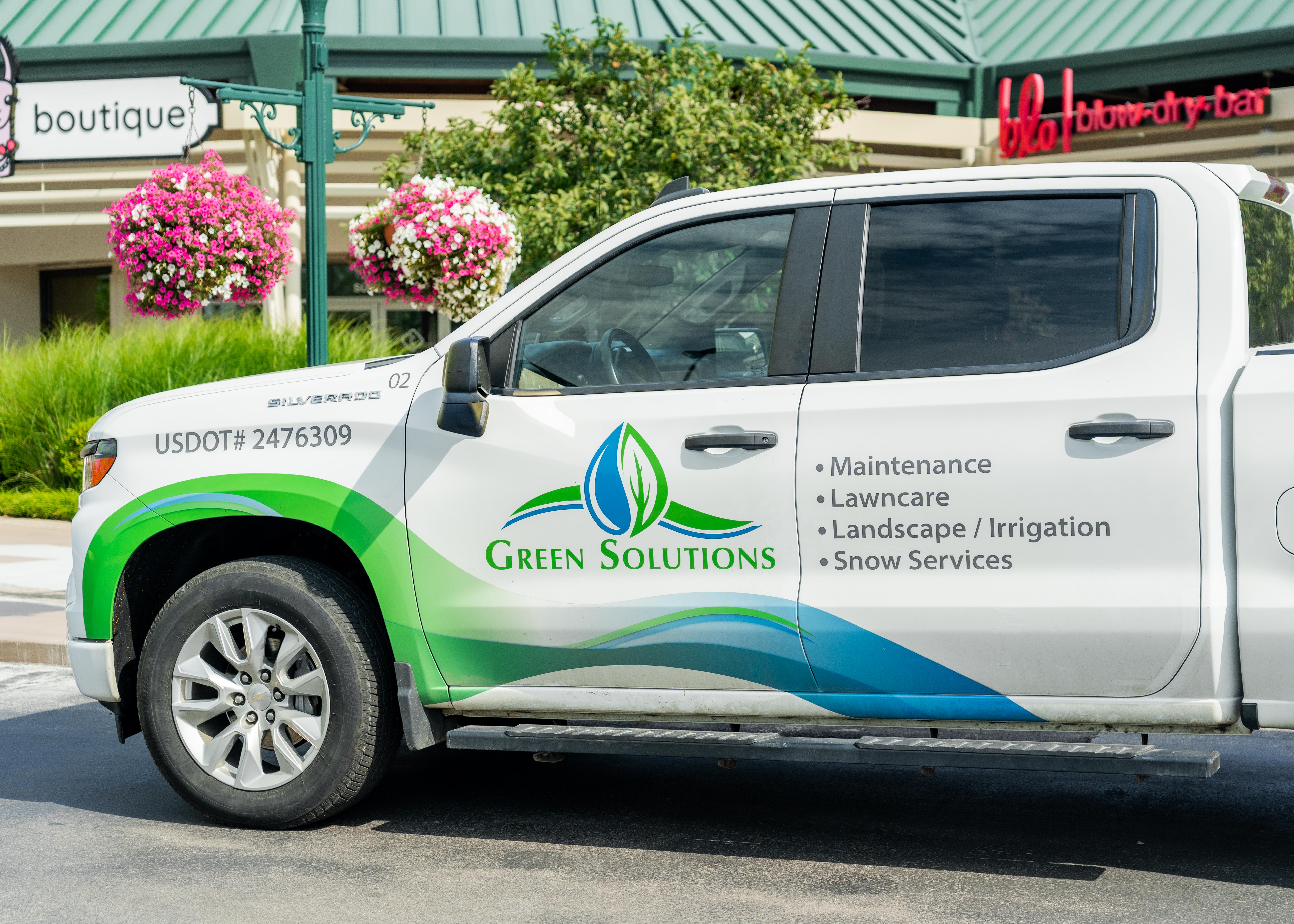 Green Solutions Landcare service truck parked after providing professional lawncare maintenance in Lexington KY.