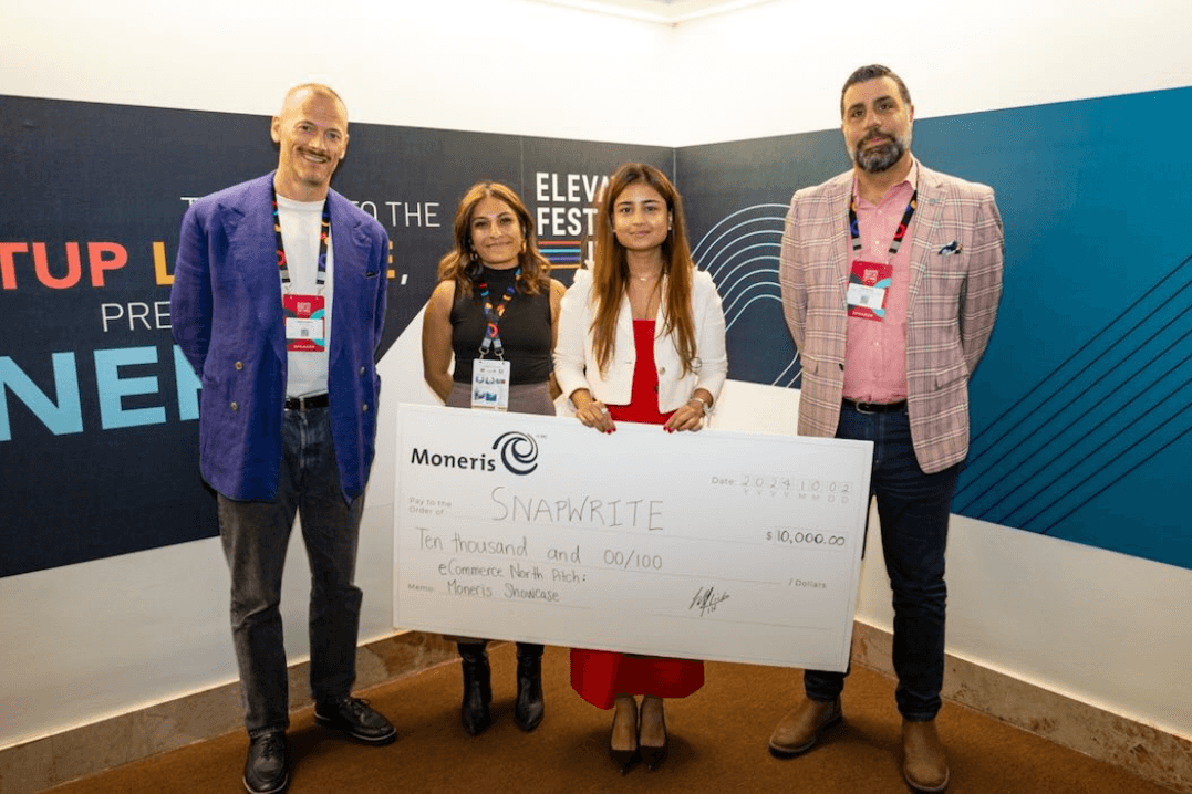 Close-up of lush, dark green leaves, some glossy and wet, against a muted background.