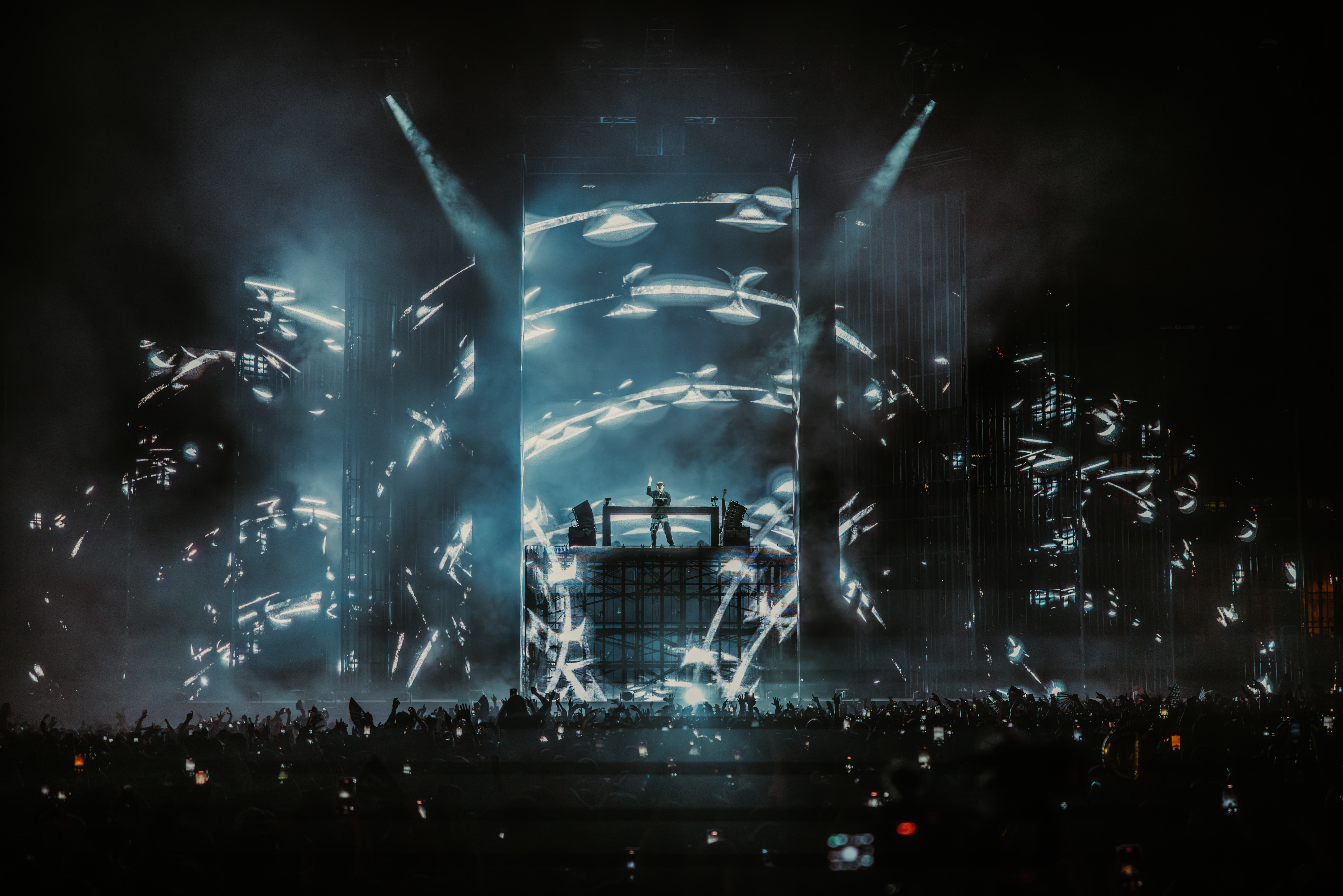 Dom Dolla performing beneath immersive, high-contrast visuals at LA State Historic Park, captured by Brandon Densley of A World Away