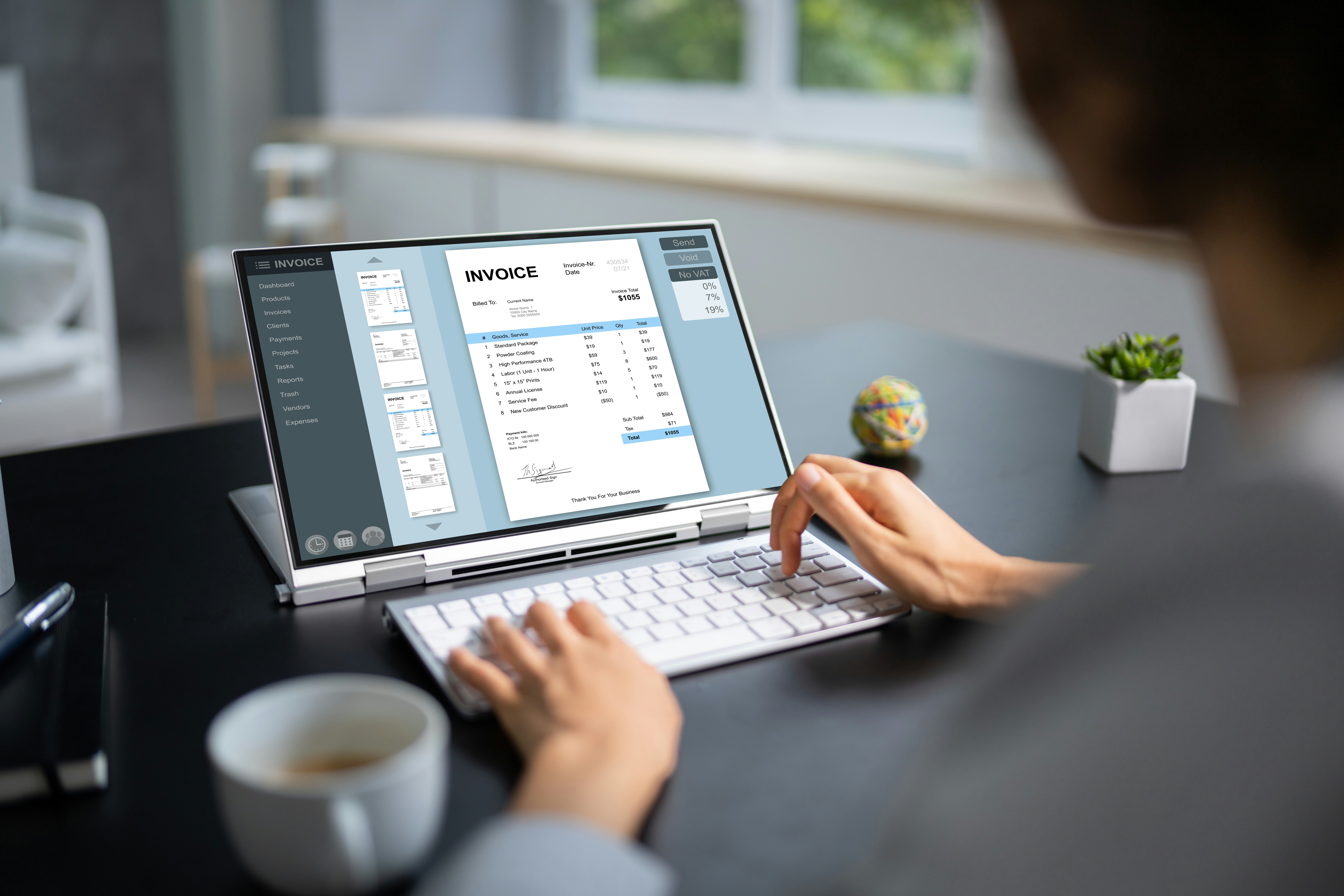 person at laptop screen showing an invoice