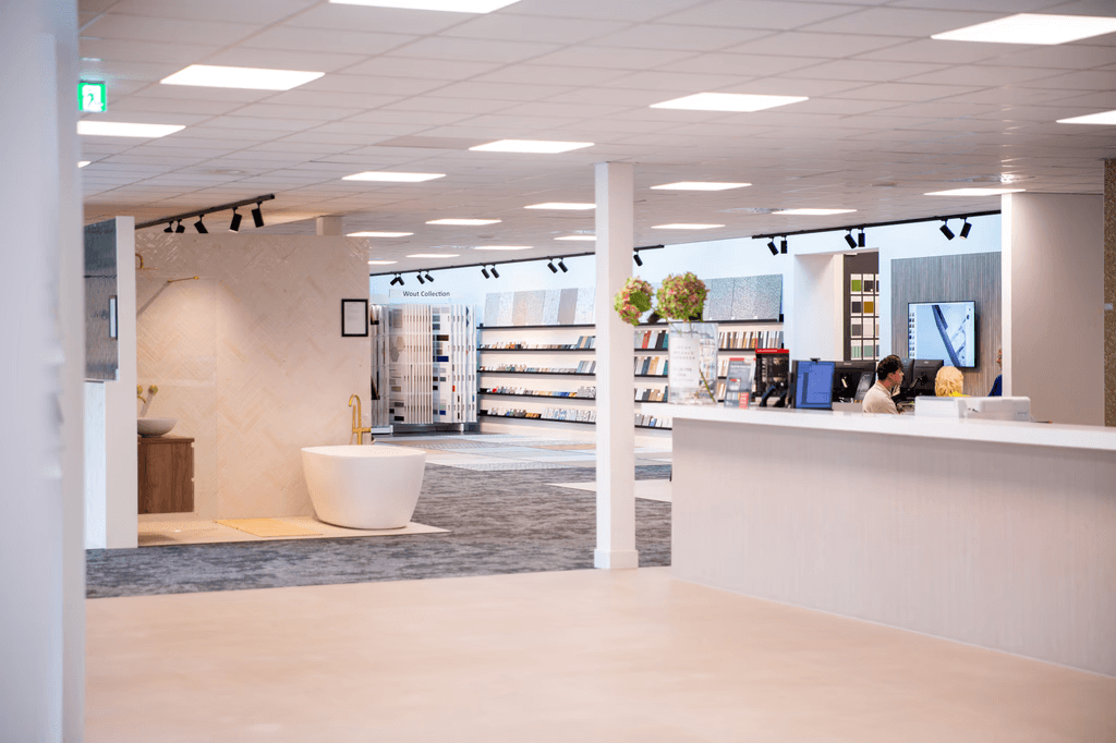 Exterior of a building with orange awnings and a sign above the door that reads “Prospect.”