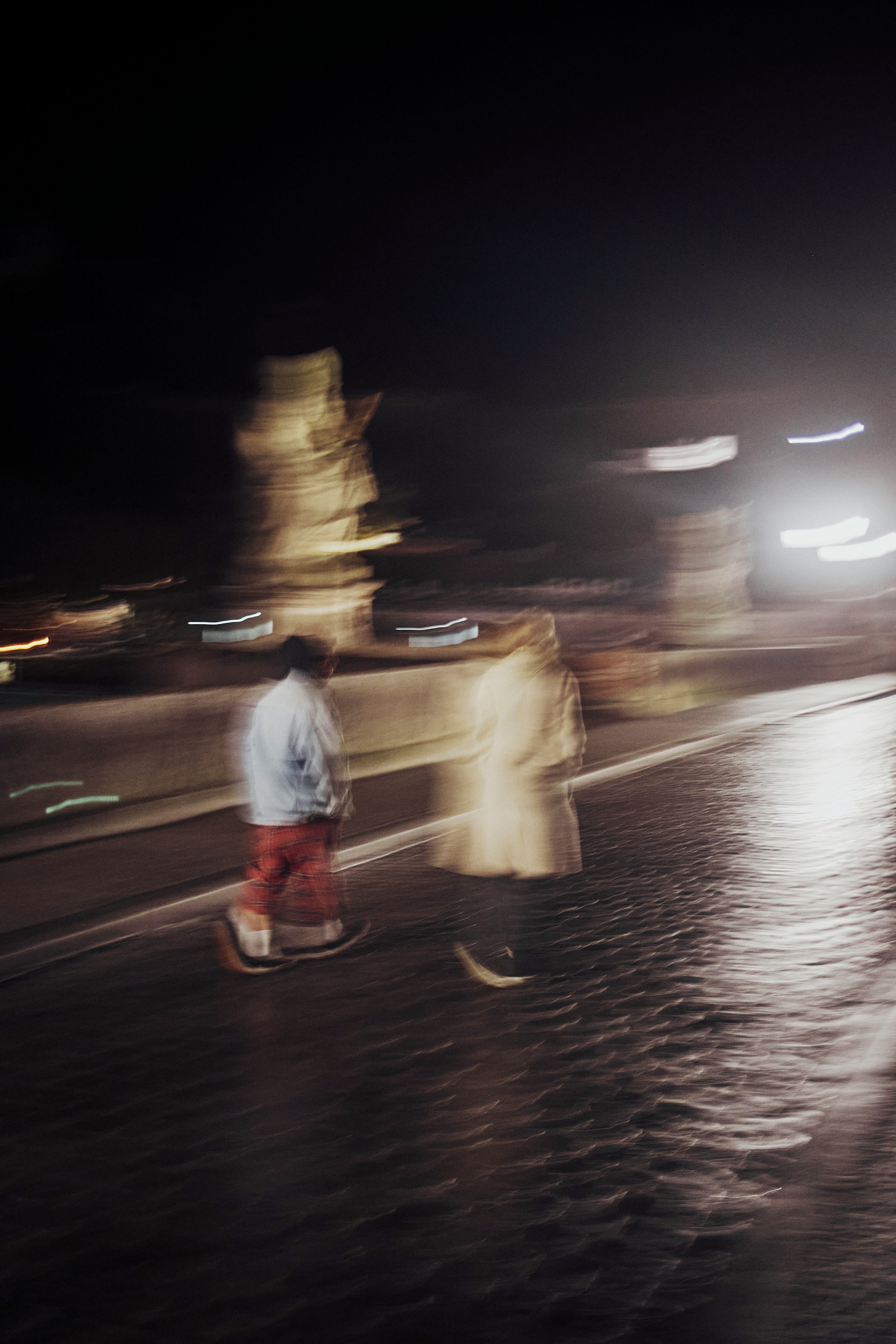A surreal portrait of a person in motion, with light streaks and a blurred effect creating a dynamic and artistic vibe.