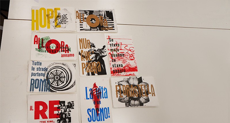 Colorful yellow, blue, red, green and brown posters depicting key words in different languages