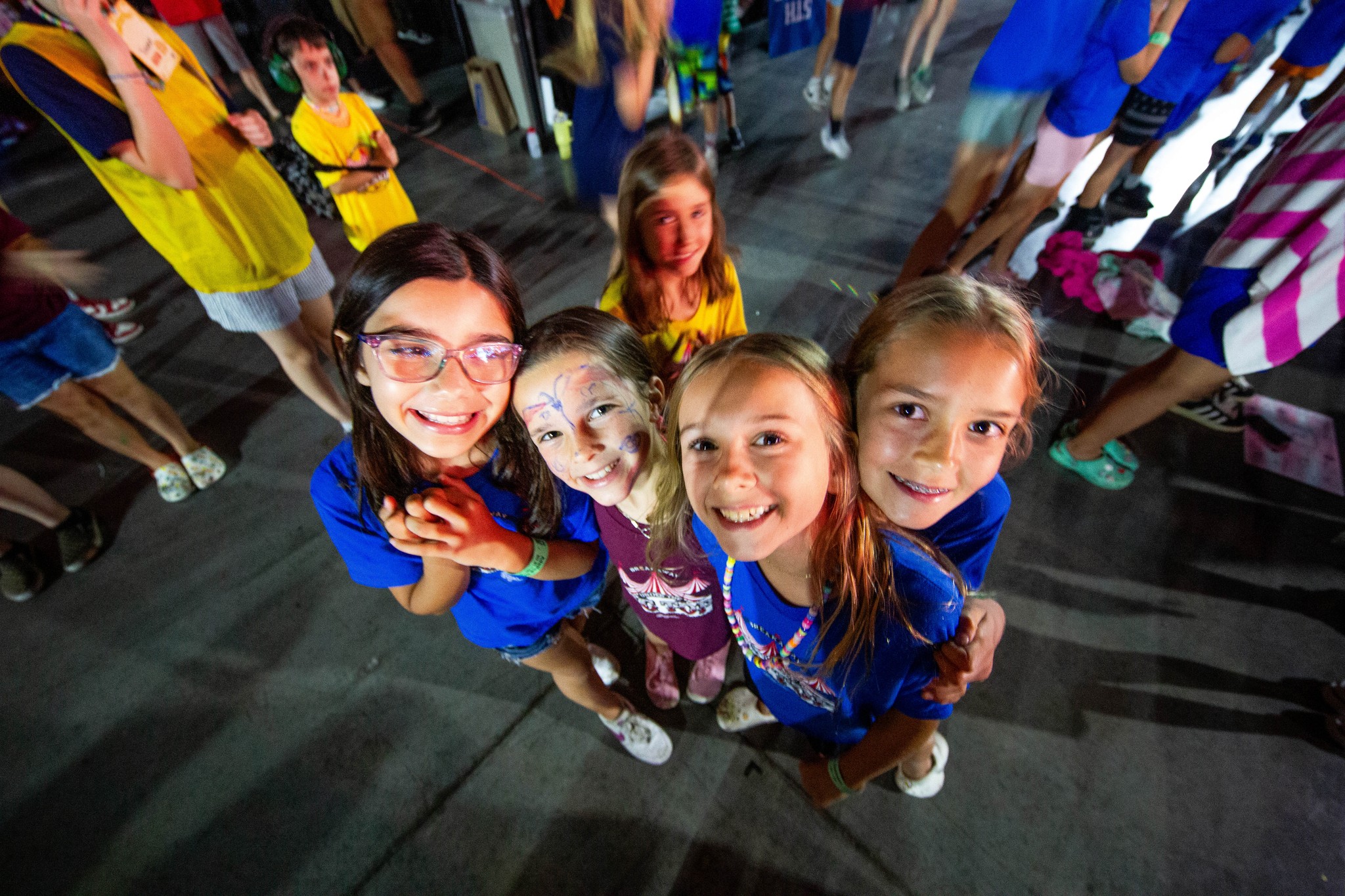 two people looking at a tablet and smiling
