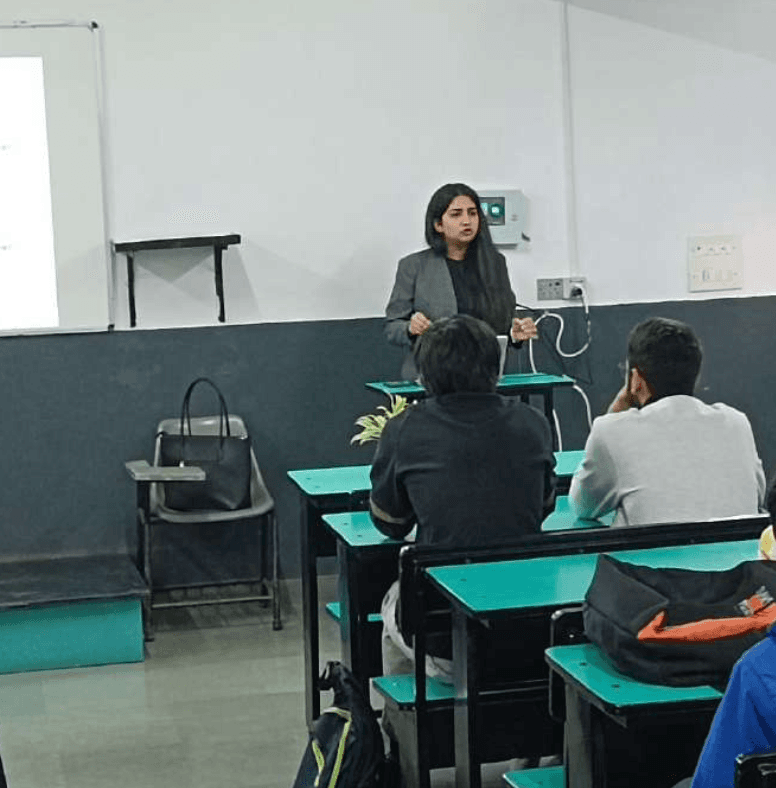 people in a large building with Tate Modern in the background