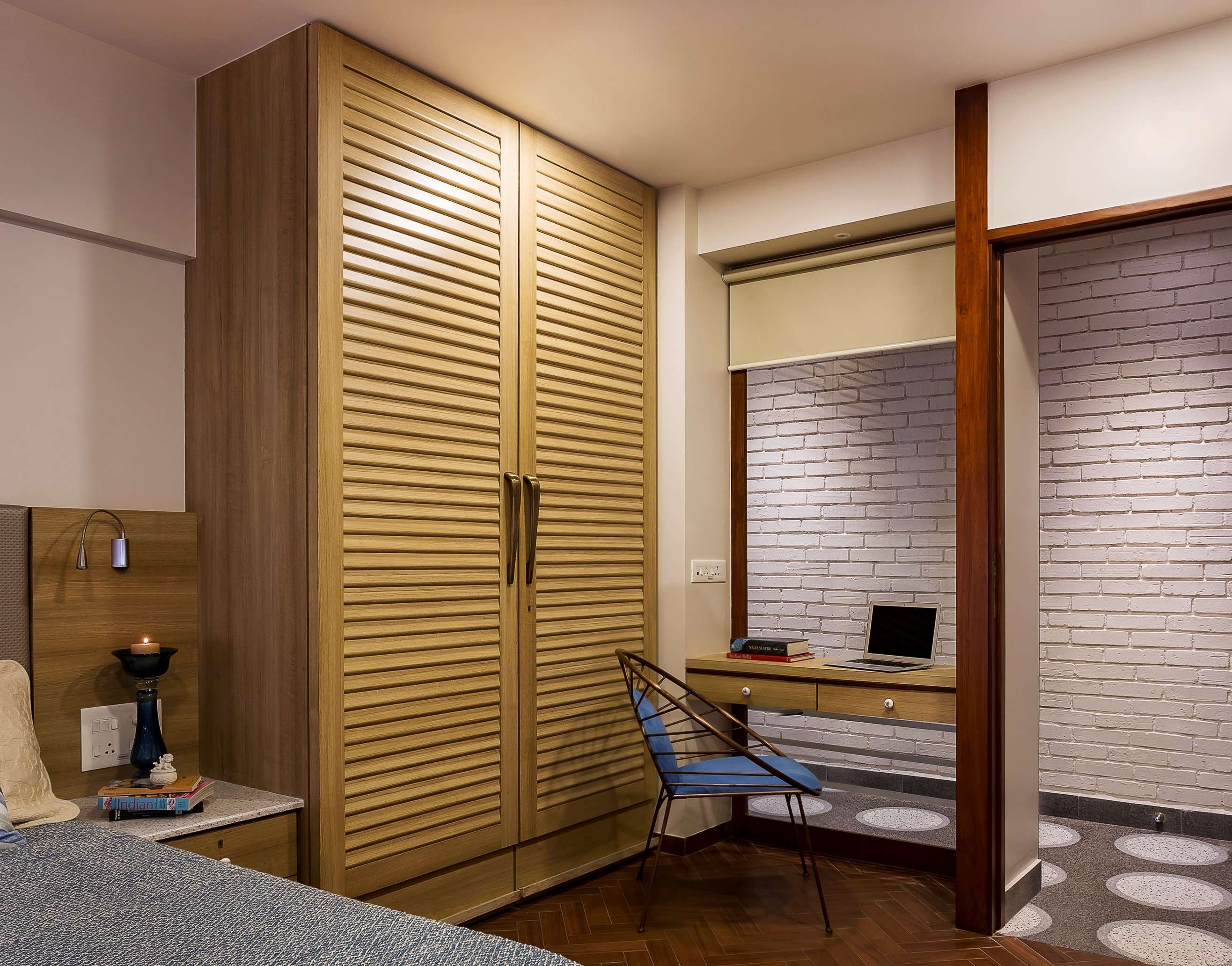 Nature-inspired preschool entrance with sculptural tree partitions and suspended green leaf ceiling panels.