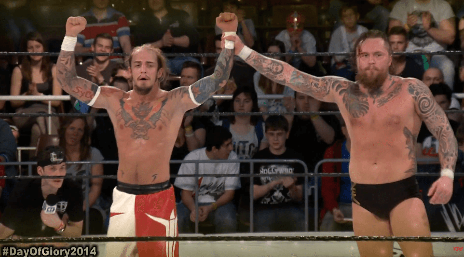A rustic kitchen scene featuring glass jars of sourdough starter on a wooden table, with a notebook filled with handwritten recipes, a brown bowl of flour, and a beige fabric apron, illuminated by soft natural light from a window.
