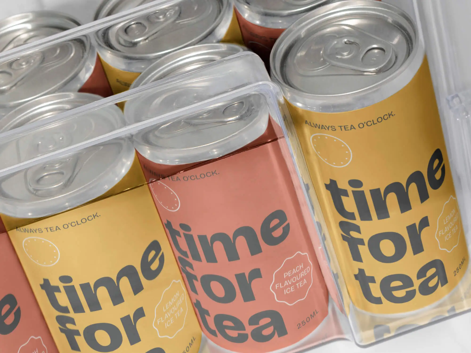 Time for Tea tea cans displayed in a refrigerator, showcasing the brand logo, colors, and distinctive packaging design.