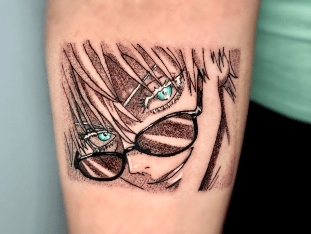 A vibrant tattoo of a chainsaw-like creature on a person's forearm. The tattoo is detailed with shades of orange, black, teal, and red.