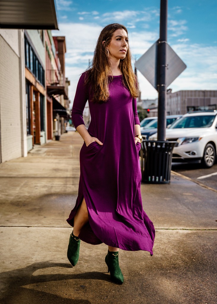 A woman in a field of sunflowers