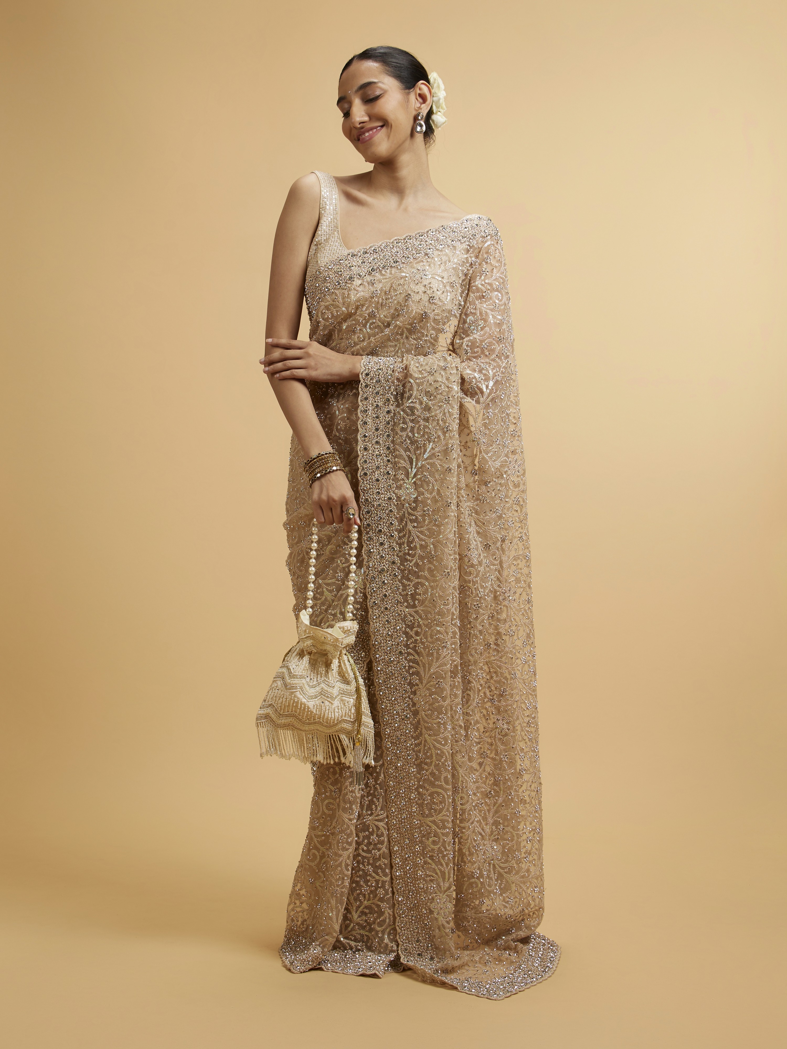Person sitting on a ledge overlooking New York City skyline