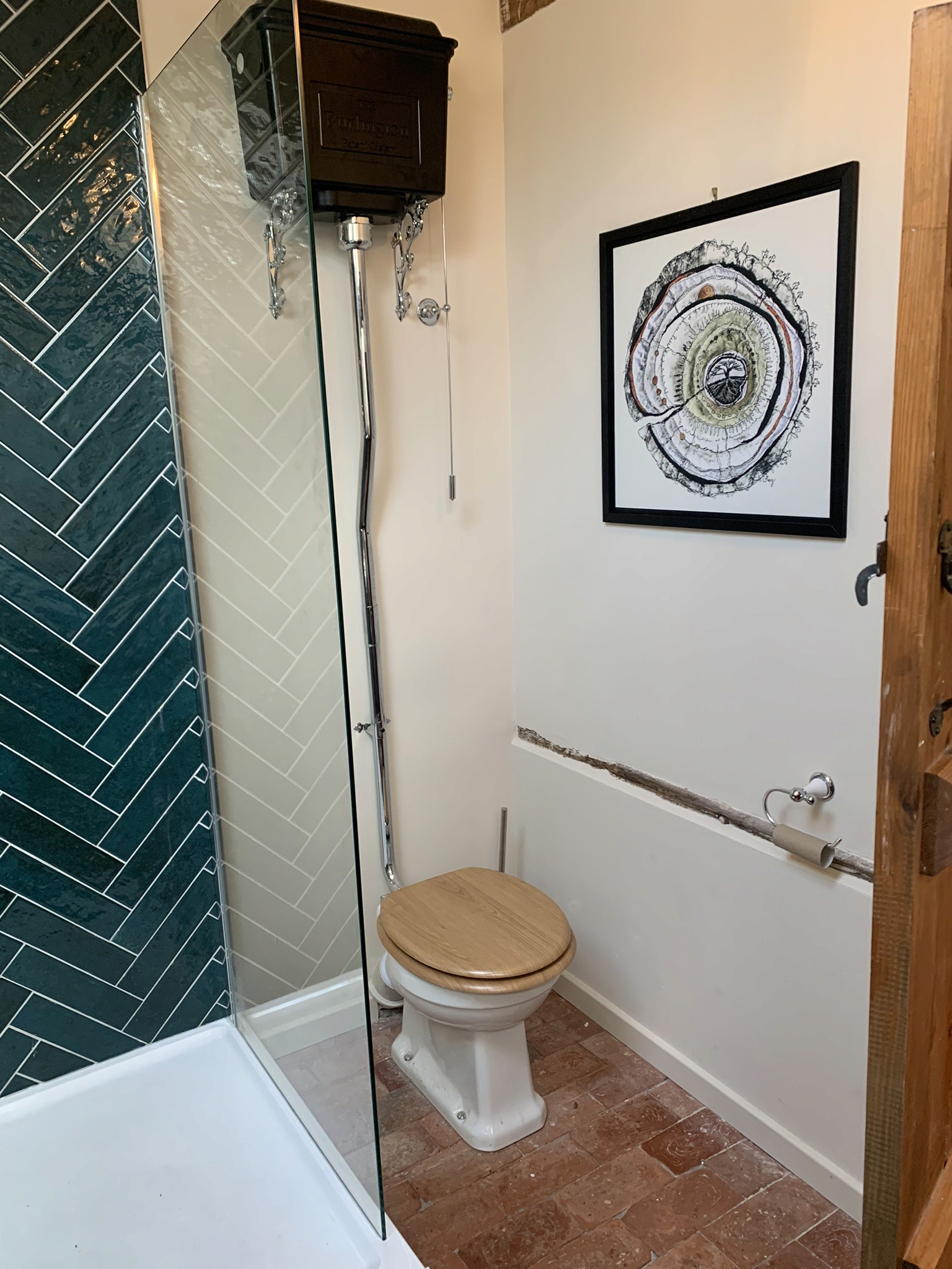 Wall hung traditional cistern toilet in luxury bathroom