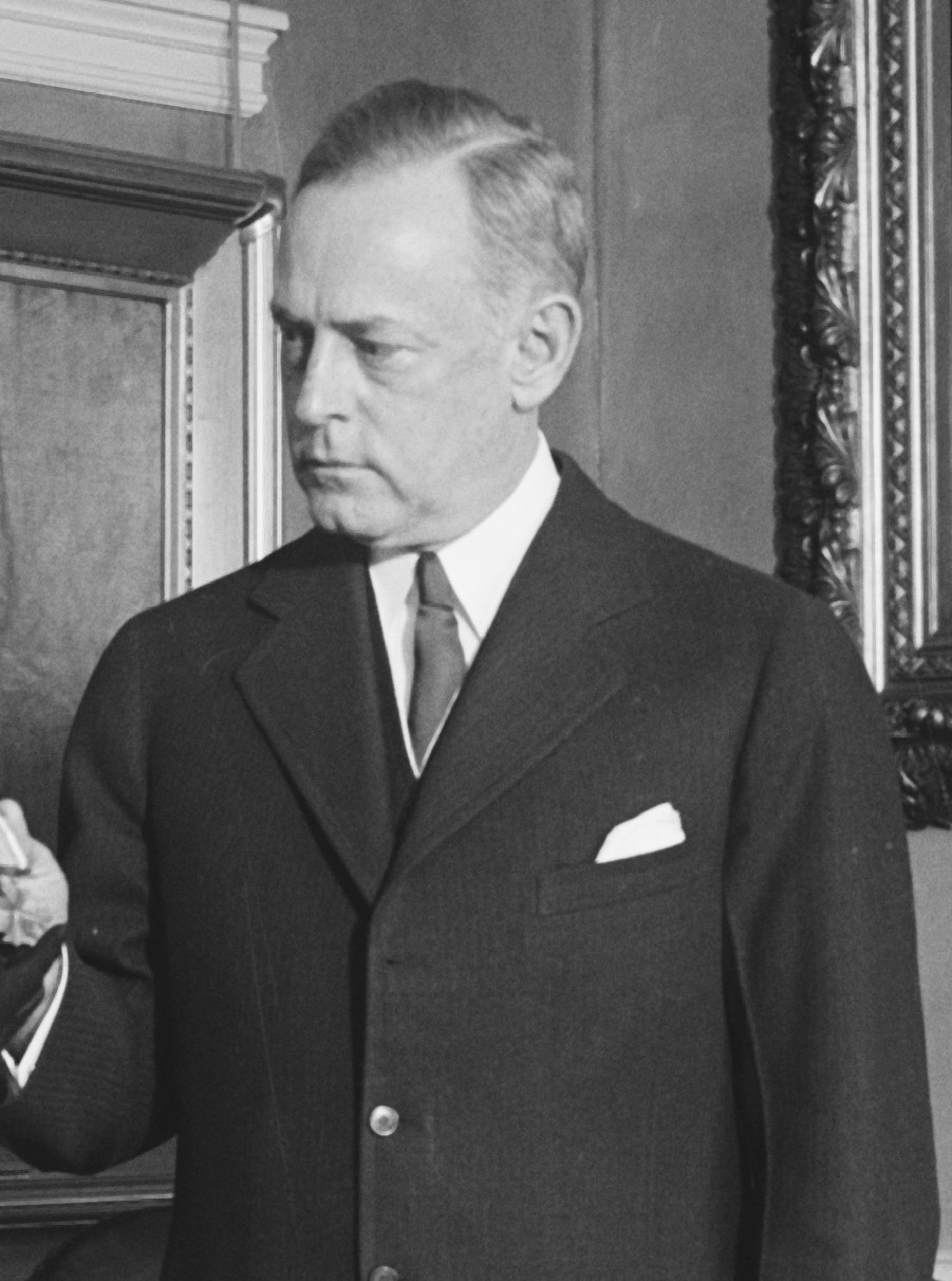 person sitting in a chair in front of a man