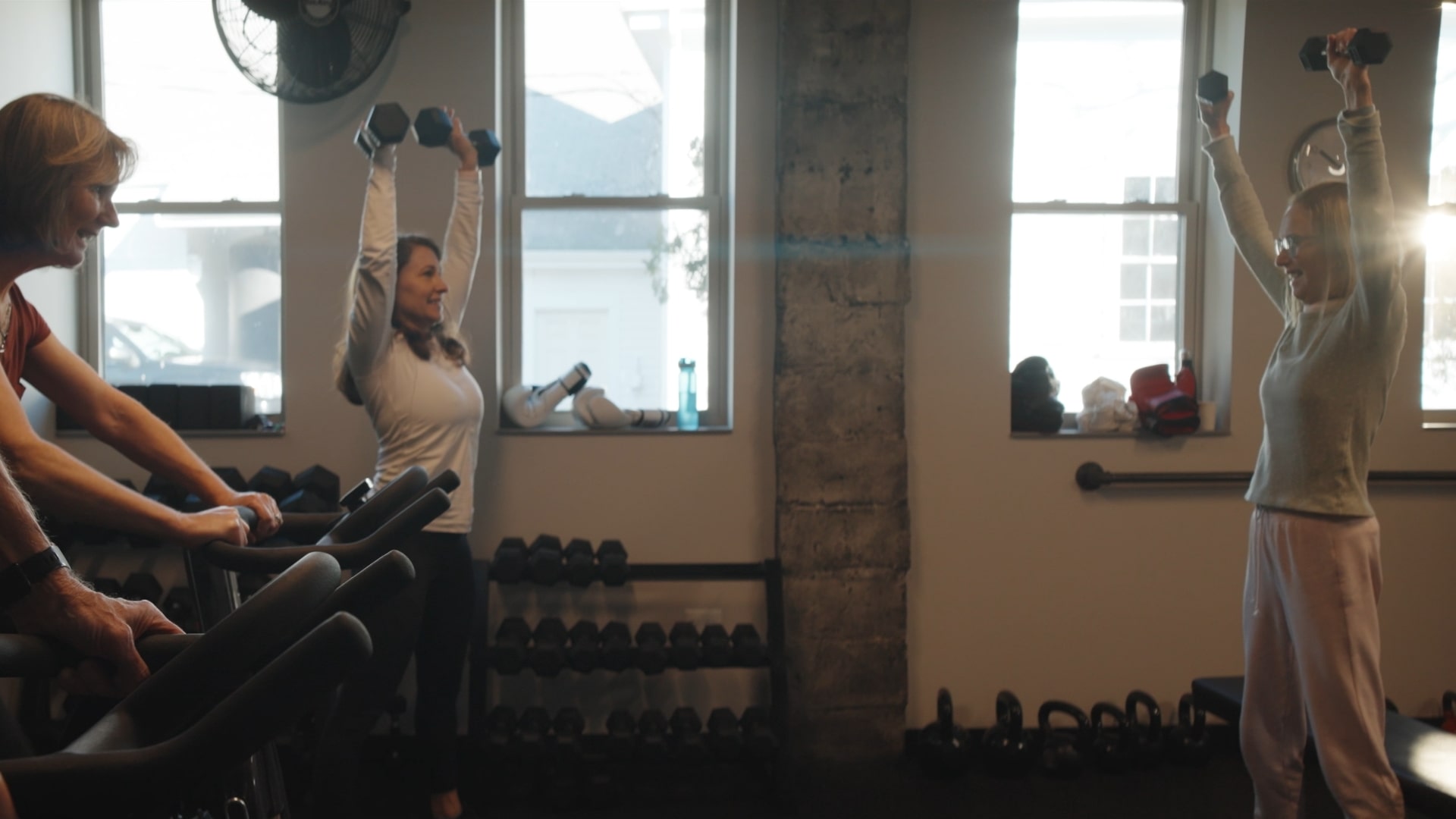 Front cover image for a short film made for Bayer. The image is of three people lifting weights and working out.