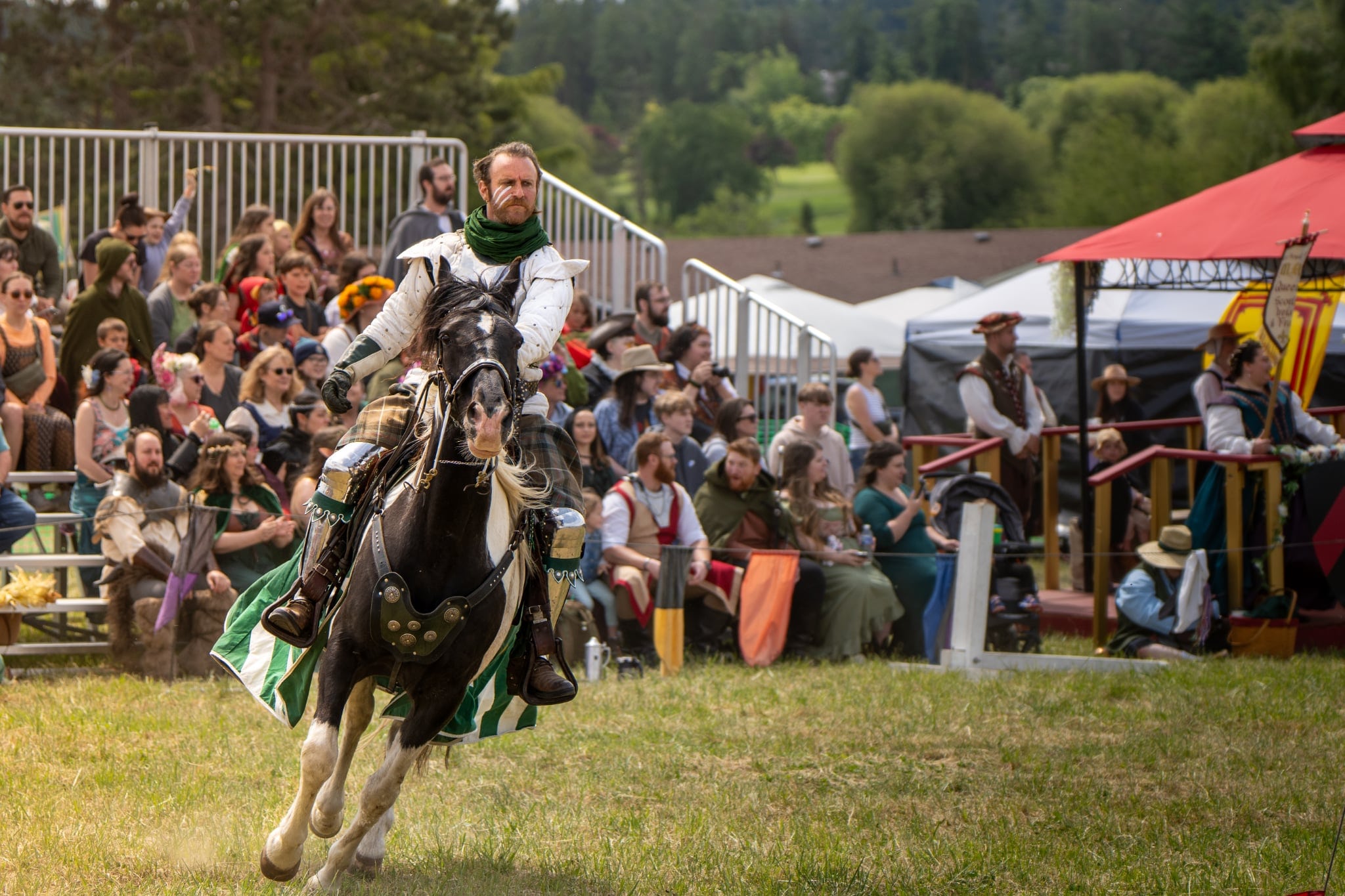 Mounted knight performing sword fighting demonstration at Whidbey Ren Faire
