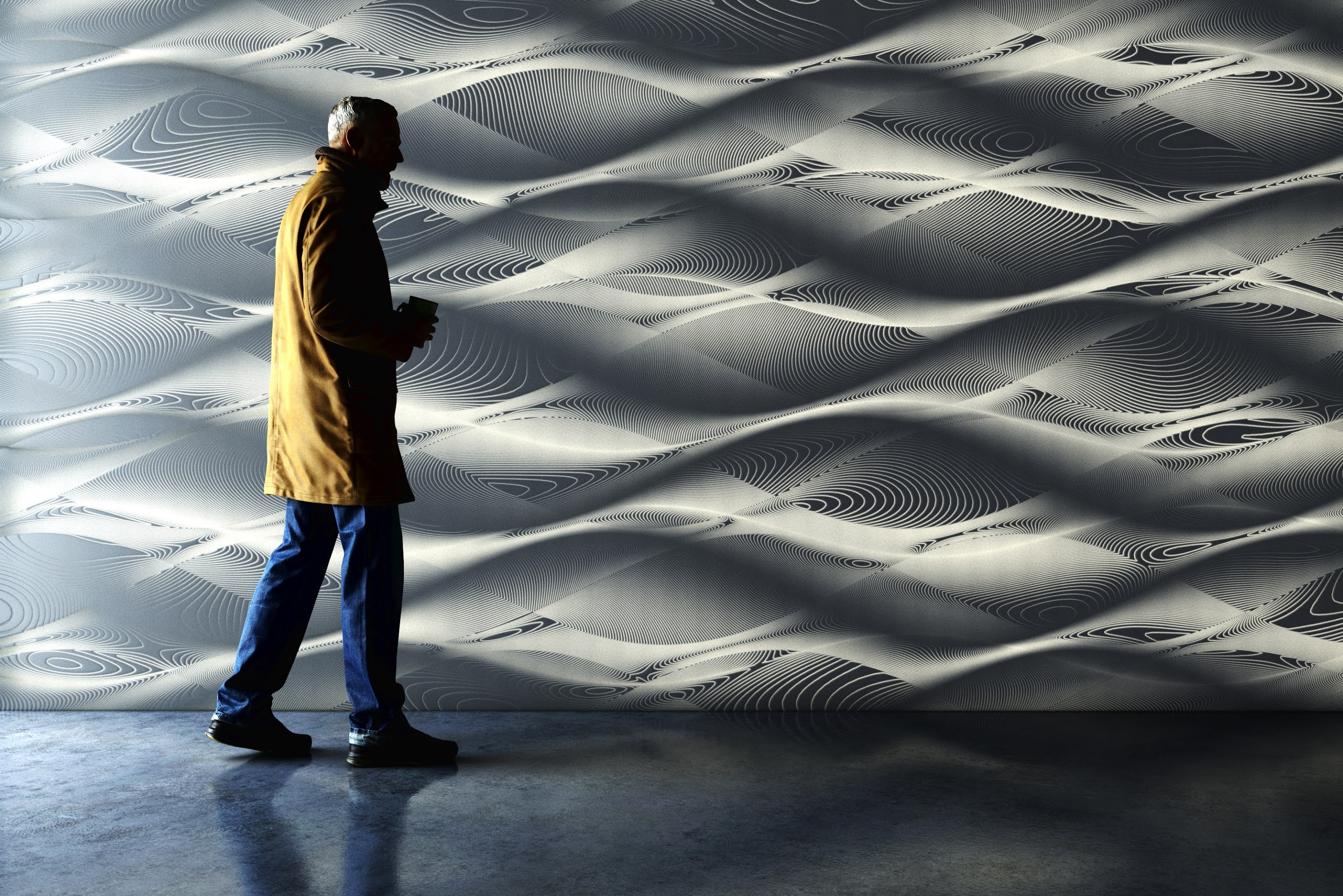 Black and white image of people working at a table with laptops, showing hands gesturing during discussion of digital content displayed on screens, with fabrica® logo in the corner.
