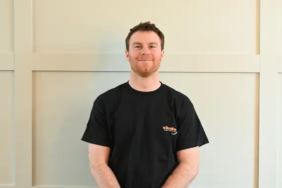 man in white crew neck shirt wearing black framed eyeglasses