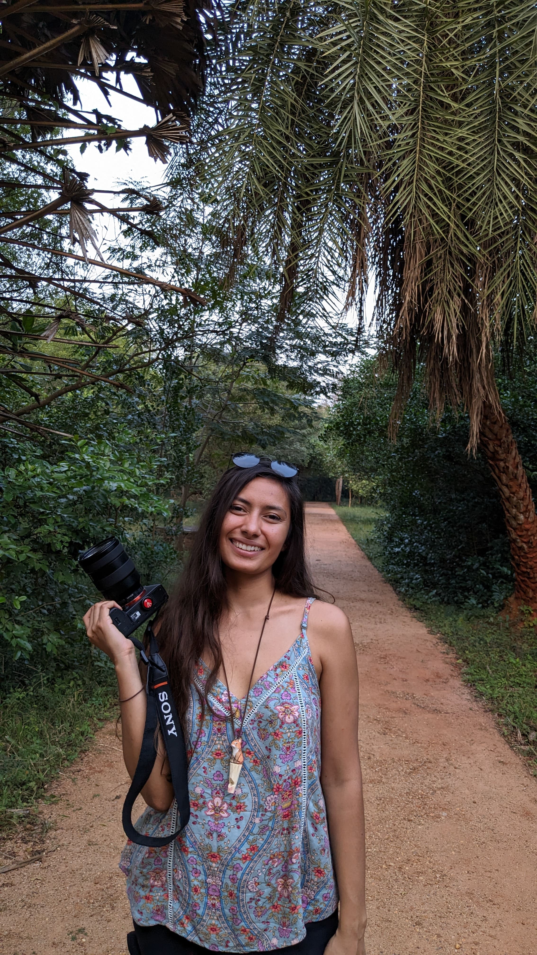 Gabriela with the camera in the nature of Auroville