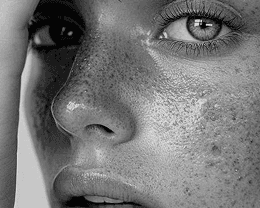 a woman sitting on a chair with her legs crossed