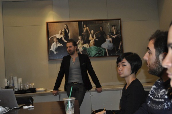A photo of a group of people listening to a lecture.
