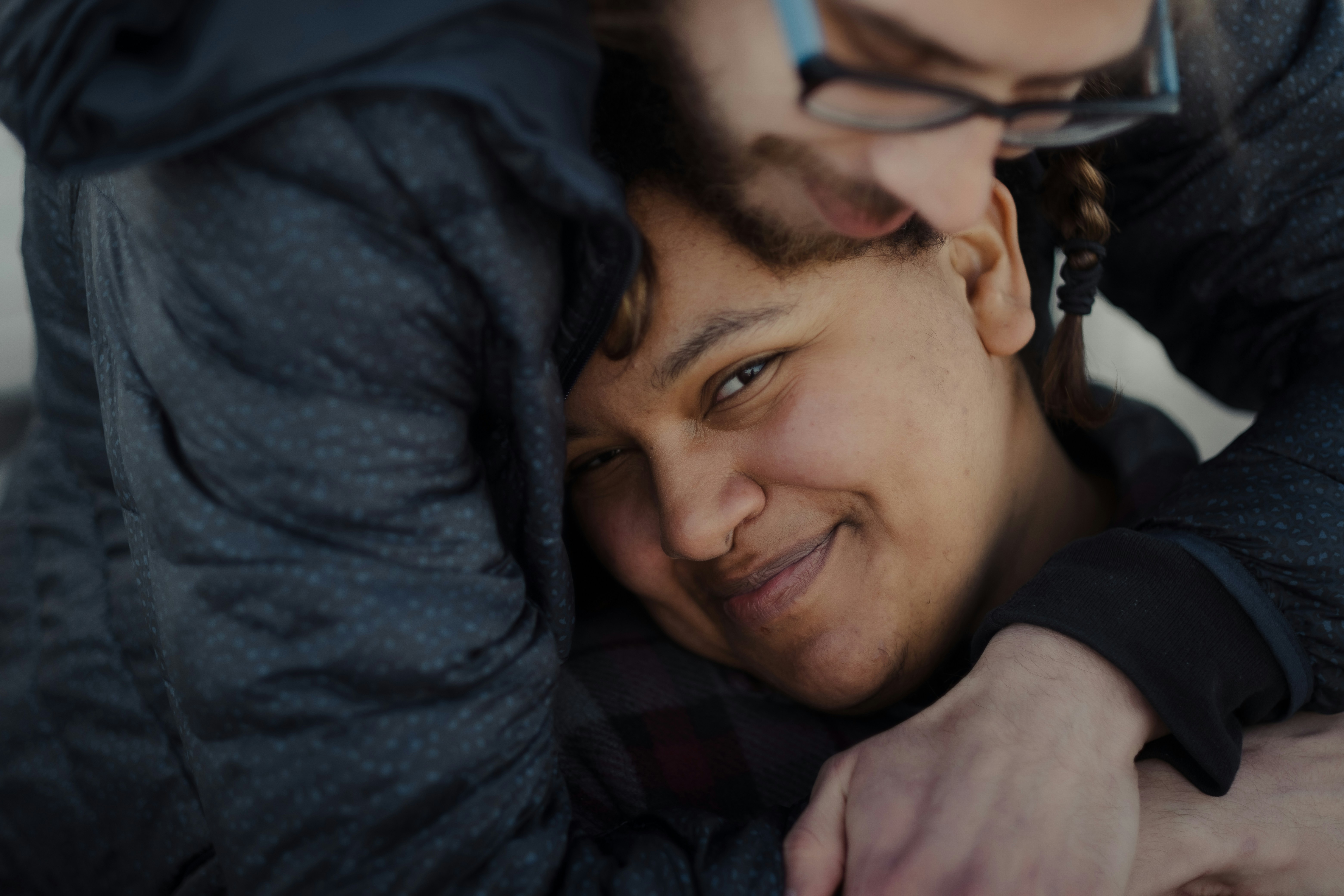 man in grey t-shirt holding white ceramic plate
