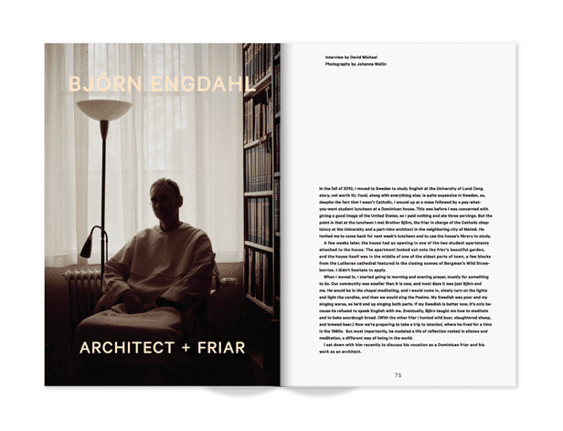 The image shows a black and white photograph of a book spread open on a surface. The left page displays a sepia-toned photograph of a man seated in a chair, wearing a long-sleeved shirt or robe, facing slightly to the right. A floor lamp stands behind the chair. The right page contains text in an unseen language. The title “BJÖRN ENGDAHL” appears in large, sans-serif font at the top. The text includes an interview with David Michael and photography by Johanna Wallin. Page numbers 75 and 76 are visible at the bottom.
