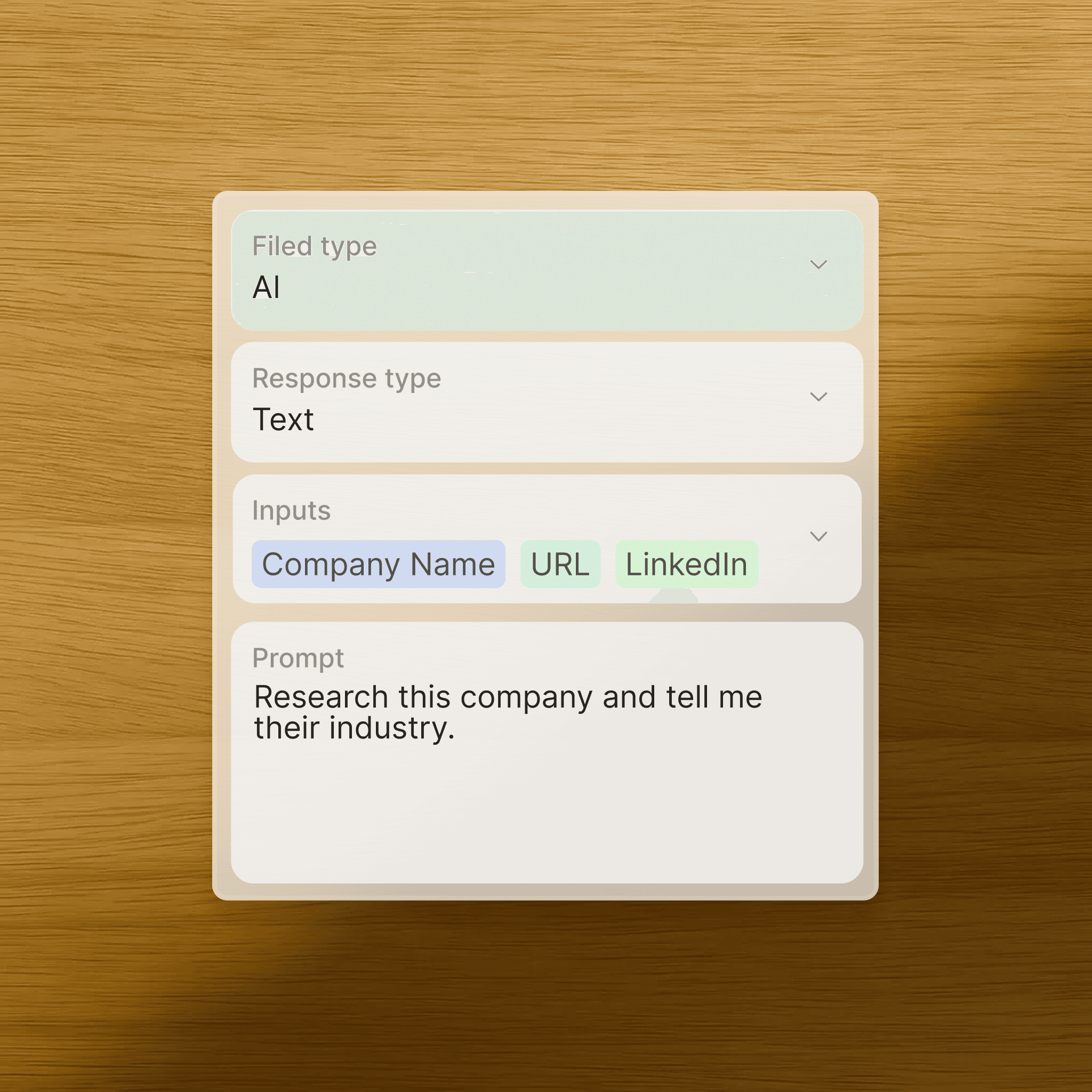 Man and woman standing together at a desk with a laptop and notebooks, smiling at the camera.